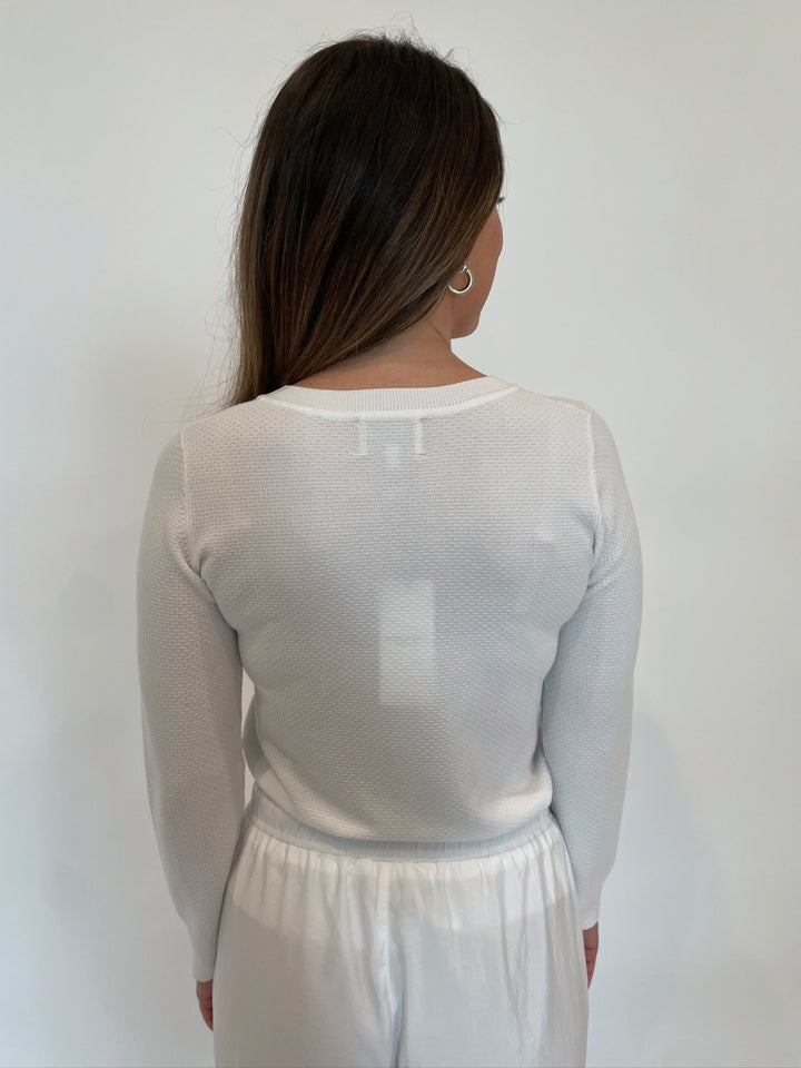 Leo & Ugo Larisa Bow Crystal Sweater in White available at Barbara Katz