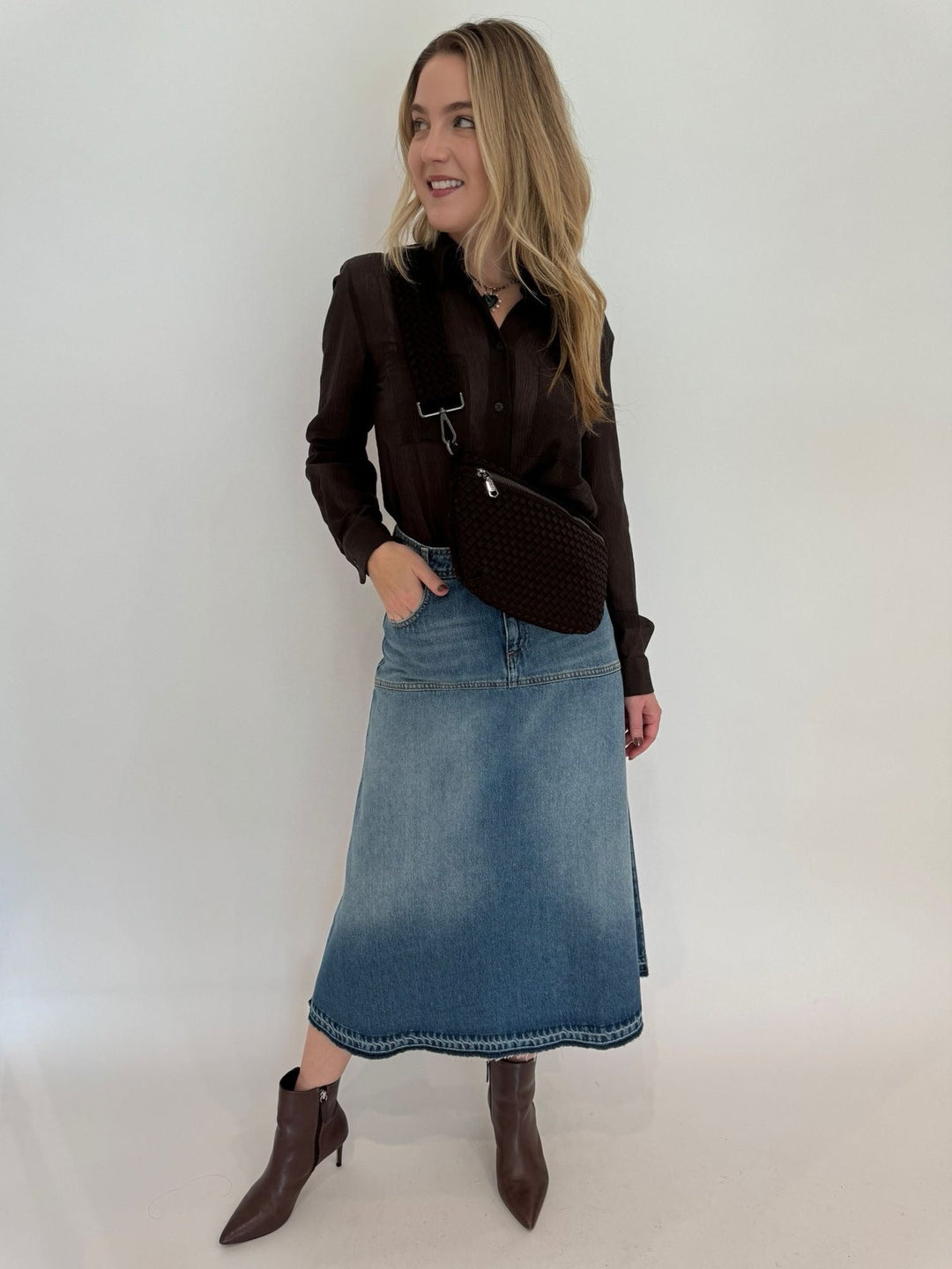 Marella Monochrome Orzo Sheer Shirt in Dark Brown paired with Ba&sh Valentia Denim Midi Skirt in Light Blue, Sol and Selene Ethereal Woven Neoprene Crossbody Bag in Chocolate available at Barbara Katz