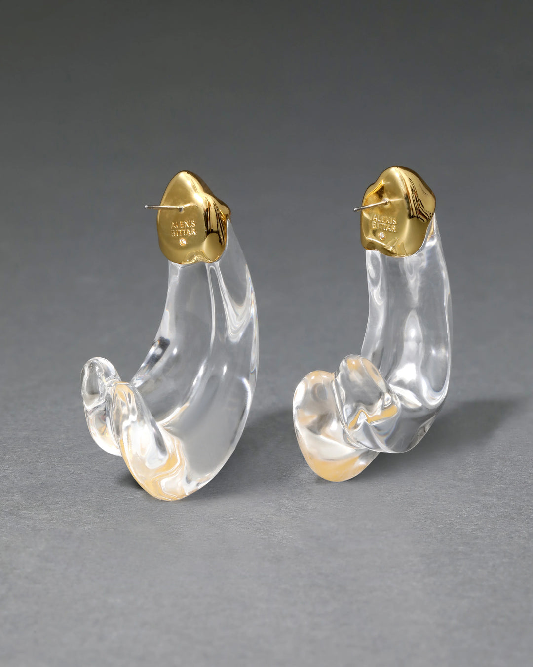 Alexis Bittar Liquid Lucite Large Wave Hoop Earrings in Clear/Gold available at Barbara Katz