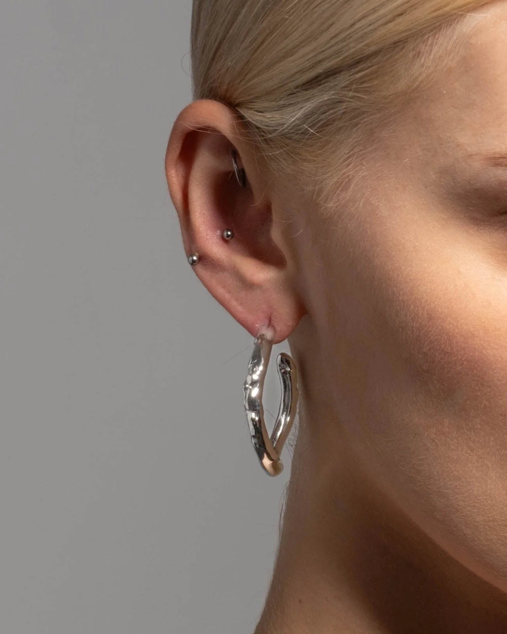 Alexis Bittar Rhodium Brut Tube Hoop Earrings available at Barbara Katz