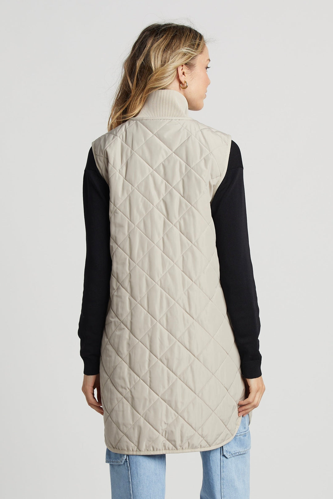 Adroit Atelier Destiny Sleeveless Quilted Vest With Side Zipper Detail in Birch available at Barbara Katz