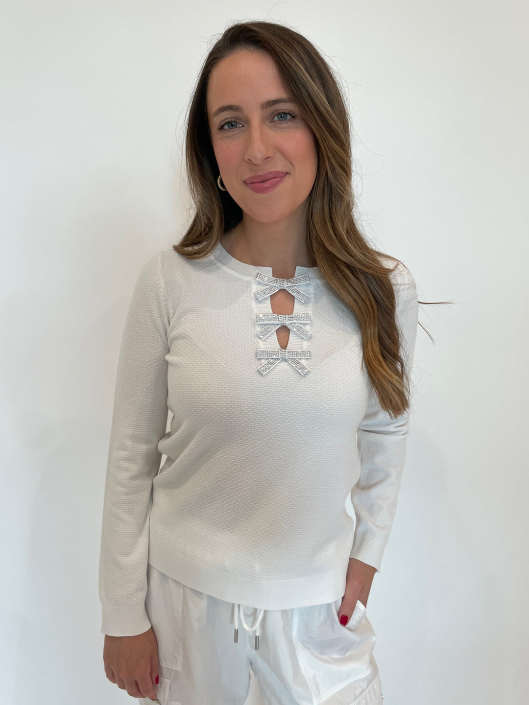 Leo & Ugo Larisa Bow Crystal Sweater in White available at Barbara Katz