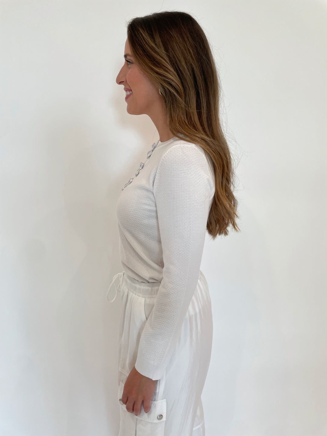 Leo & Ugo Larisa Bow Crystal Long Sleeve Sweater in White available at Barbara Katz