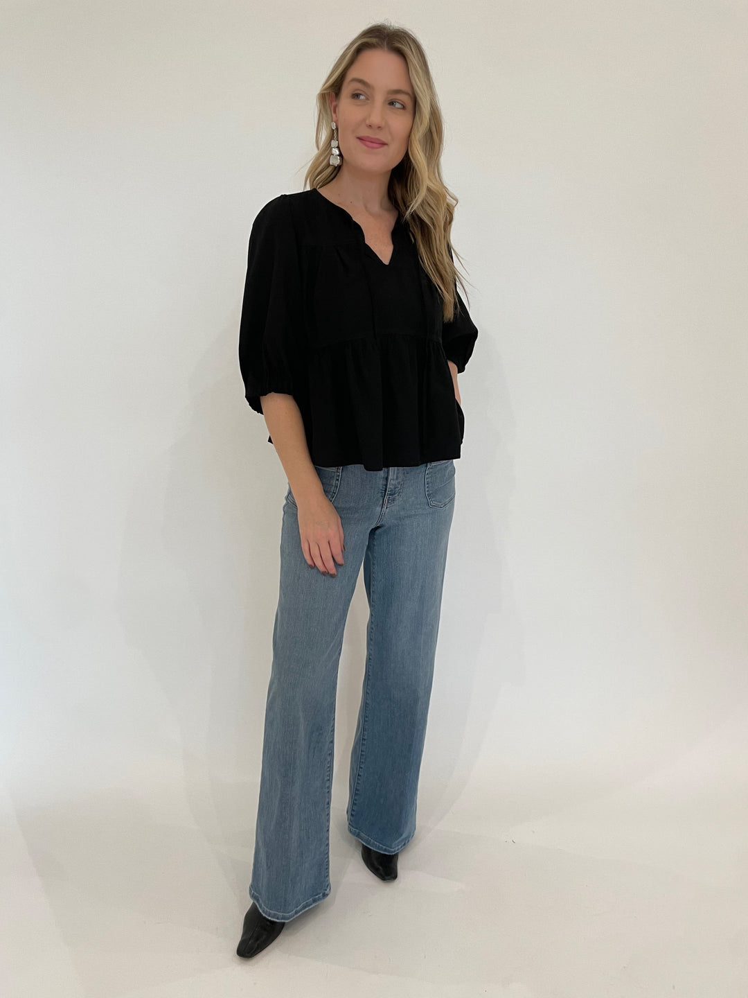 BK Ferlita Elbow Sleeve Blouse in Black paired with Frame Le Slim Palazzo Bardot Pocket Jeans in Wilson Clean available at Barbara Katz