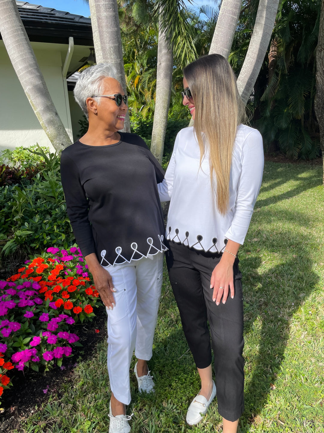 E.L.I Fany 3/4 Sleeve Top With Embroidered Trim in Black/White paired with Elliott Lauren White Crop Cargo Pants and E.L.I Fany 3/4 Sleeve Top With Embroidered Trim in White/Black paired with Elliott Lauren Black Crop Cargo Pants available at Barbara Katz