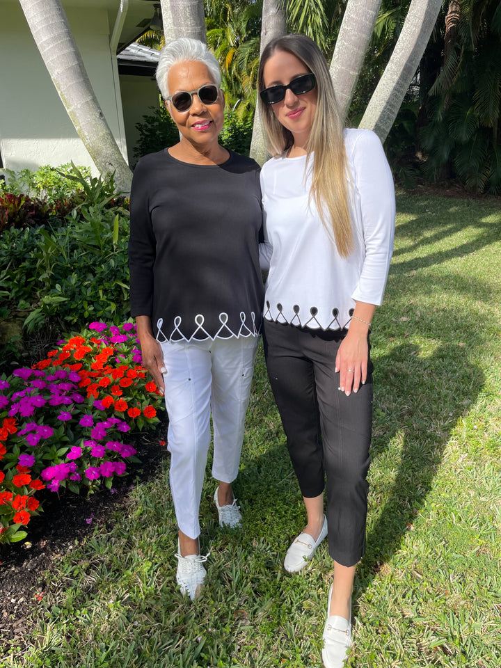 E.L.I Fany 3/4 Sleeve Top With Embroidered Trim in Black/White paired with Elliott Lauren White Crop Cargo Pants and E.L.I Fany 3/4 Sleeve Top With Embroidered Trim in White/Black paired with Elliott Lauren Black Crop Cargo Pants available at Barbara Katz