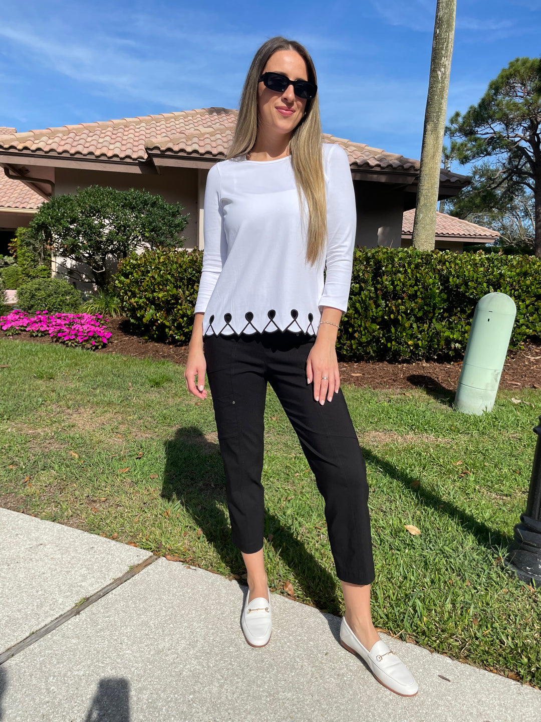 E.L.I Fany 3/4 Sleeve Top With Embroidered Trim in White/Black paired with Elliott Lauren Black Crop Cargo Pants available at Barbara Katz