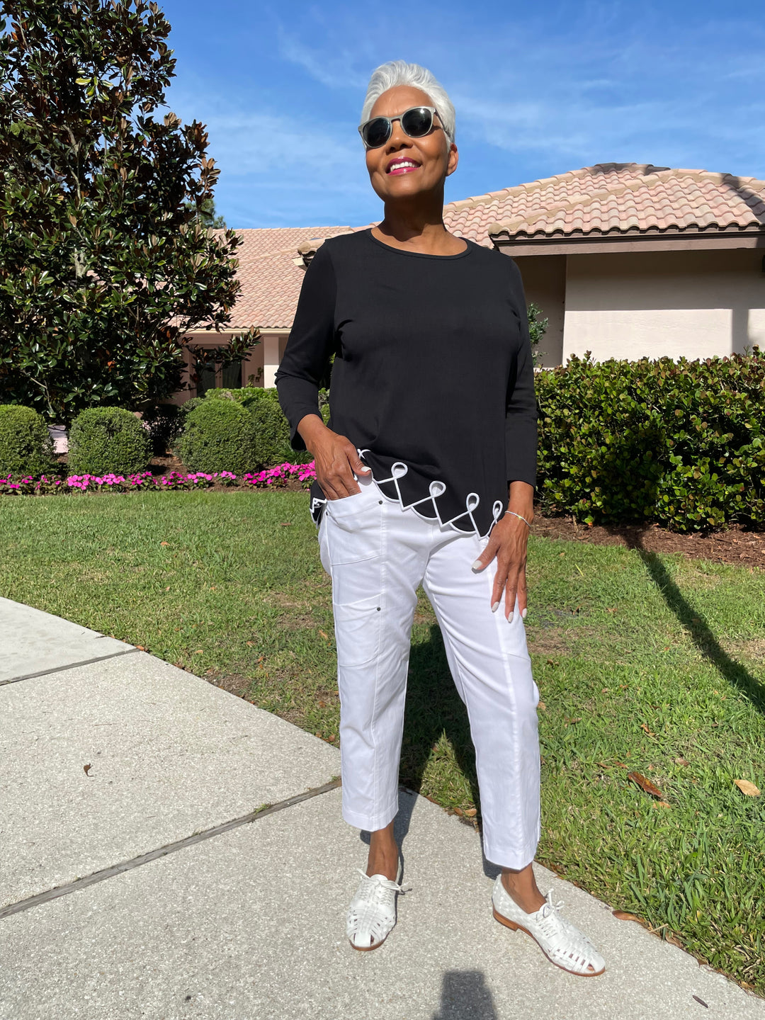 E.L.I Fany 3/4 Sleeve Top With Embroidered Trim in Black/White paired with Elliott Lauren Crop Cargo Pants in White available at Barbara Katz