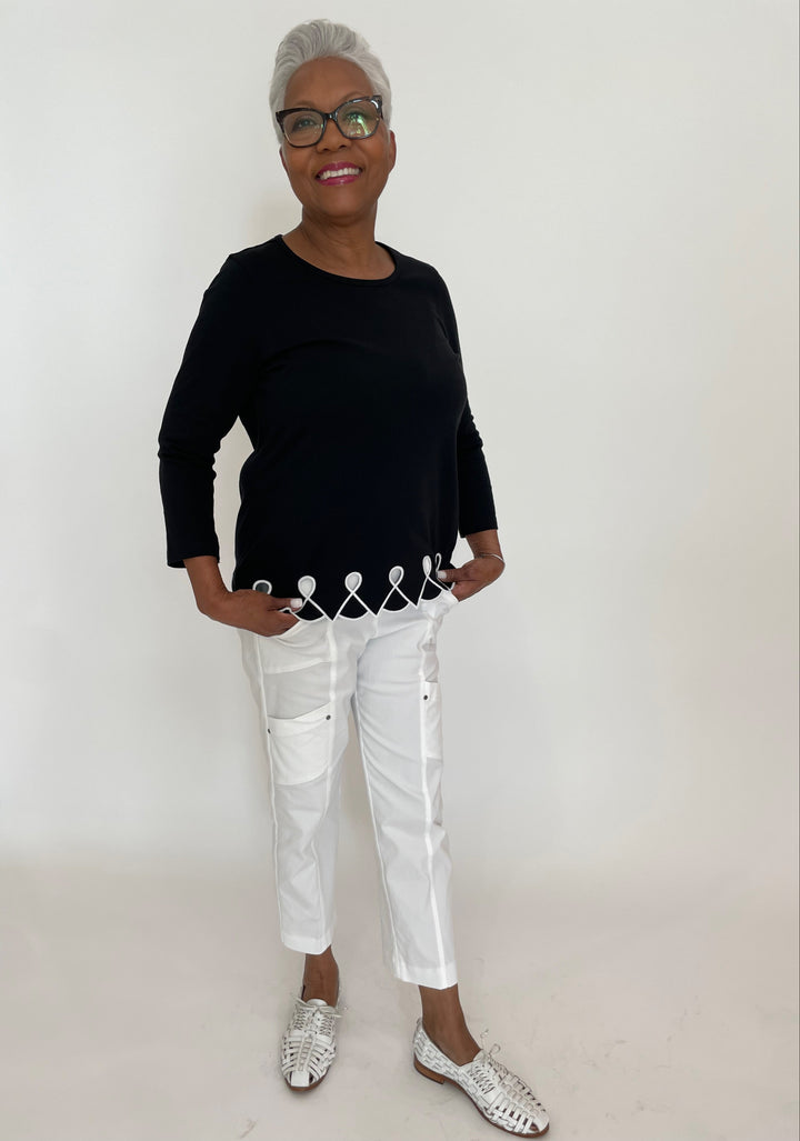 E.L.I Fany 3/4 Sleeve Top With Embroidered Trim in Black/White paired with Elliott Lauren Crop Cargo Pants in White available at Barbara Katz