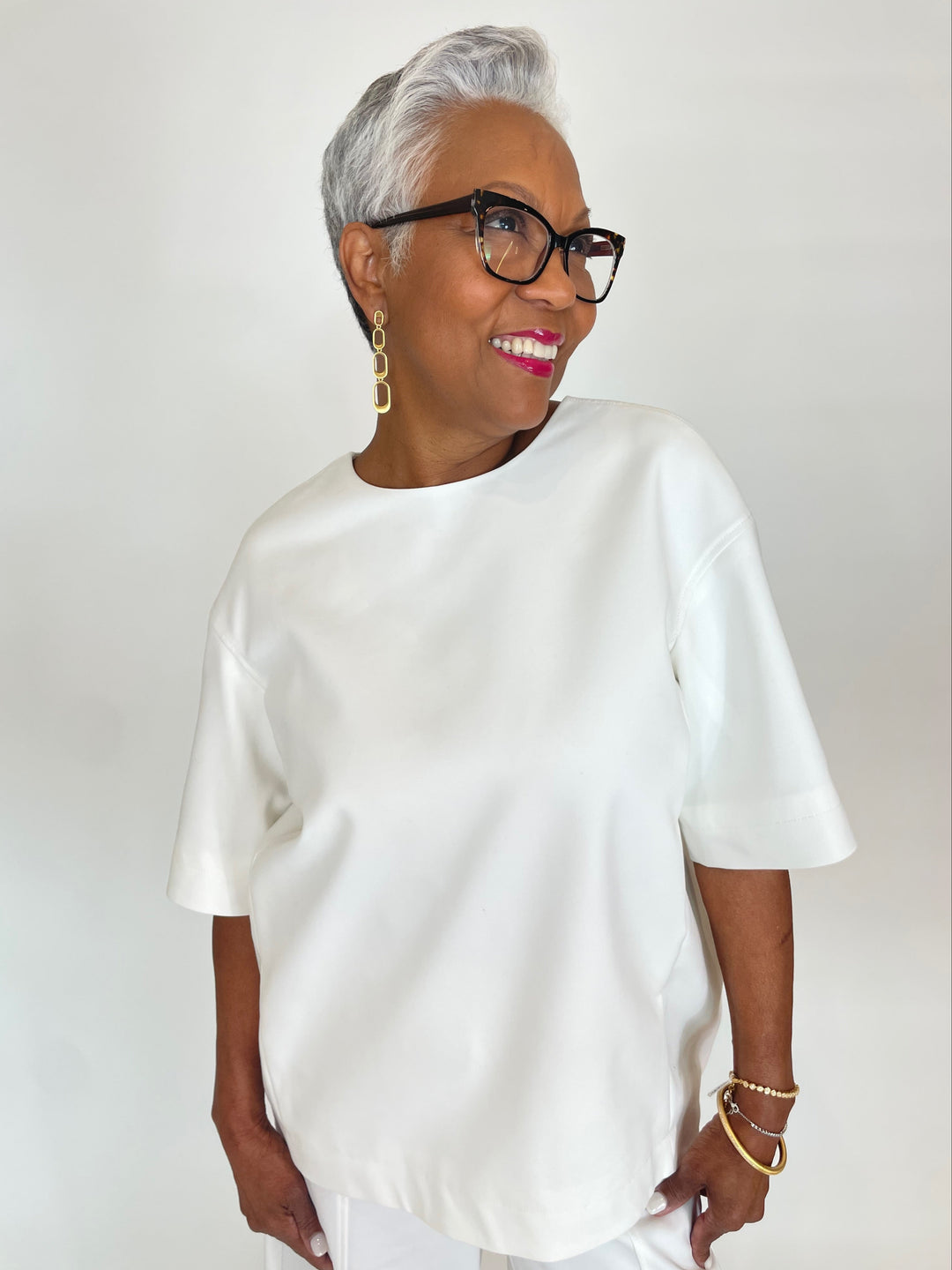 Simkhai Aude Short Sleeve Crew Top in White with Dean Davidson Bleecker Statement Drop Earrings in Gold, Mirabeau Pave Bracelet and Colette Pave Bangle Bracelet available at Barbara Katz