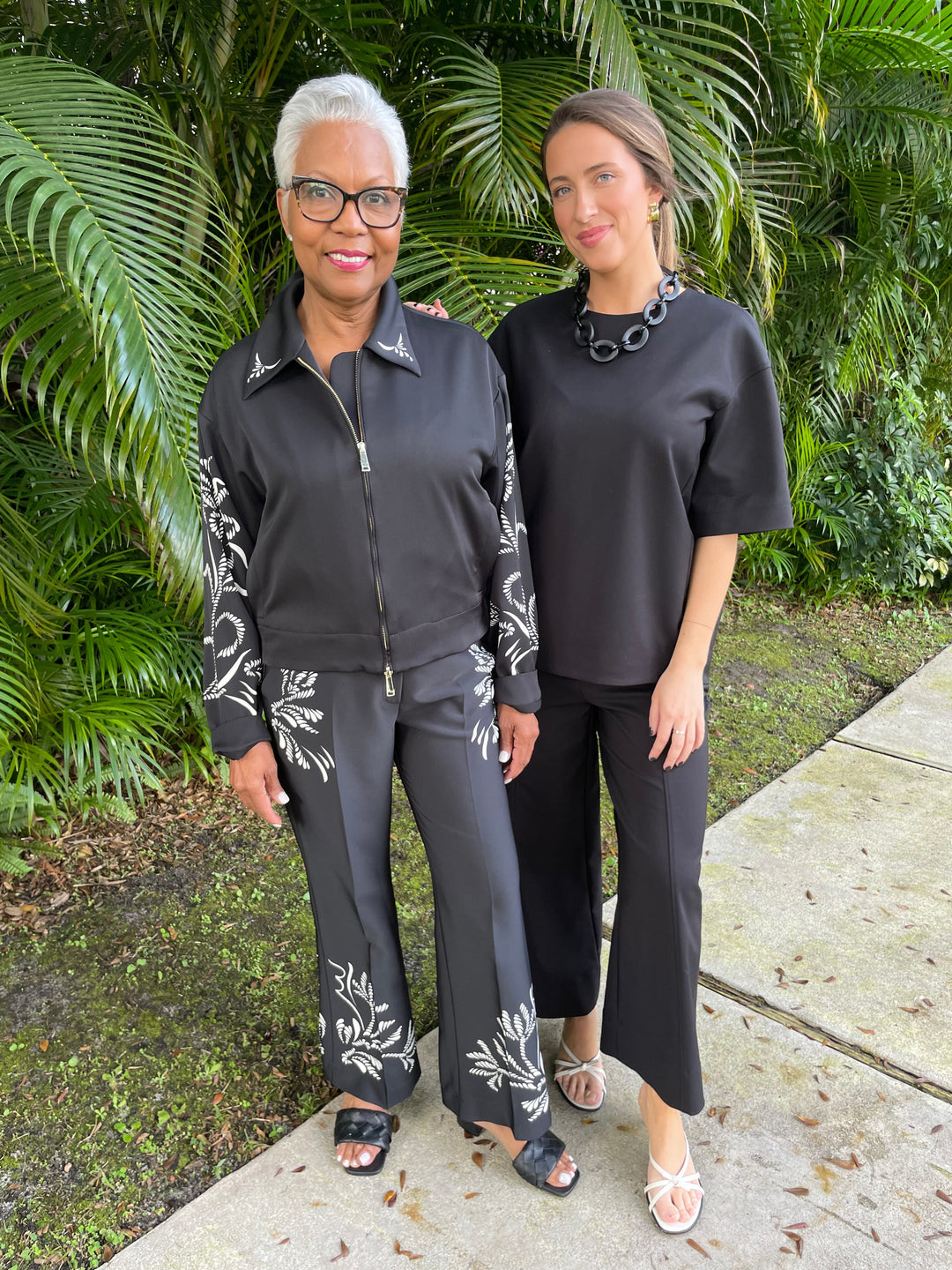 Marella Natalia Satin Blouse in Black Placed paired with matching Egizio Satin Pants, and Simkhai Aude Cotton Top in Black paired with matching Kallin Cropped Wide Leg Pants available at Barbara Katz