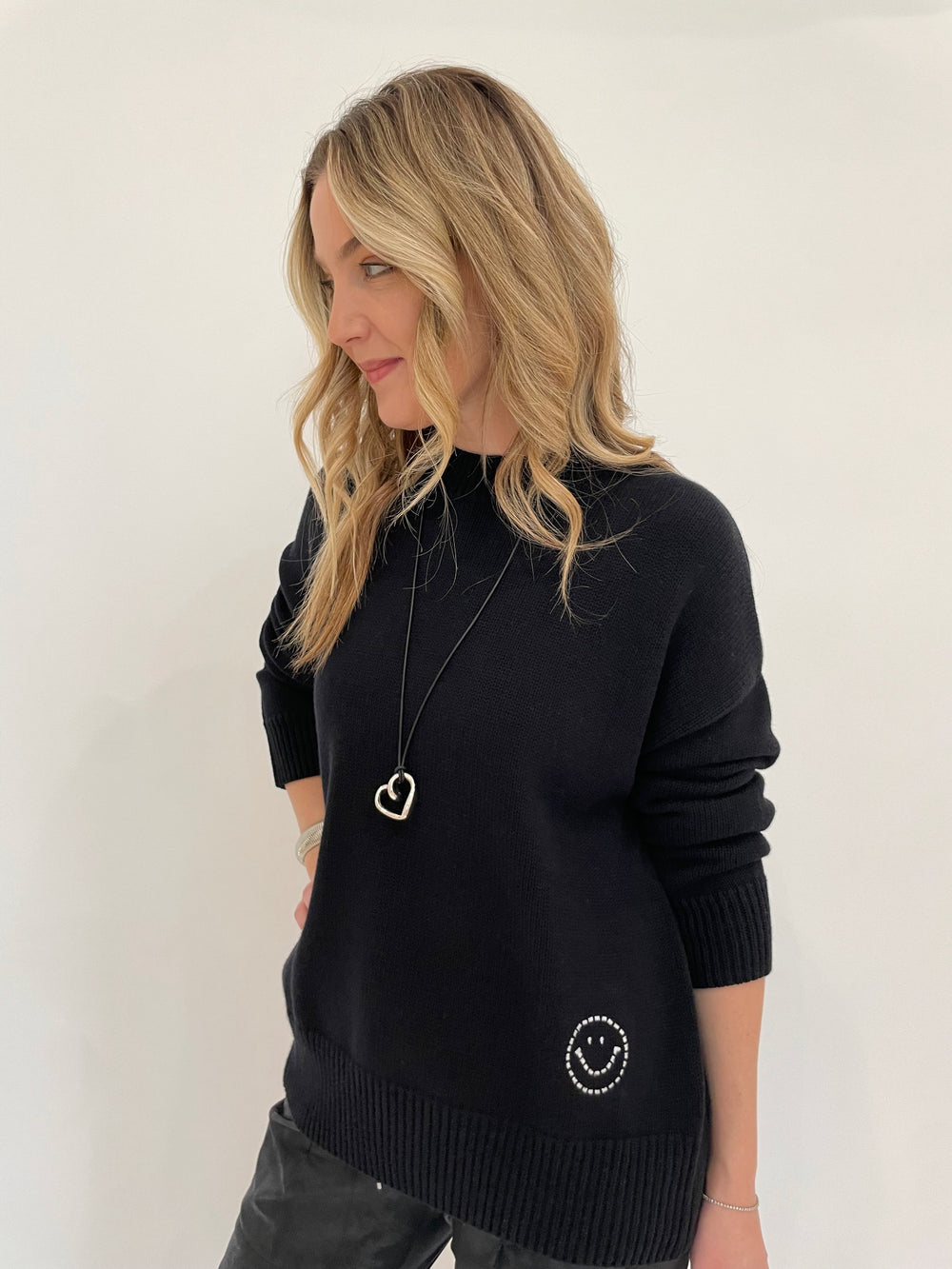 Kerri Rosenthal Benton Last Olive Sweater in Black with Paula Rosen Jewelry Small Heart Silver With Leather Cord Necklace available at Barbara Katz