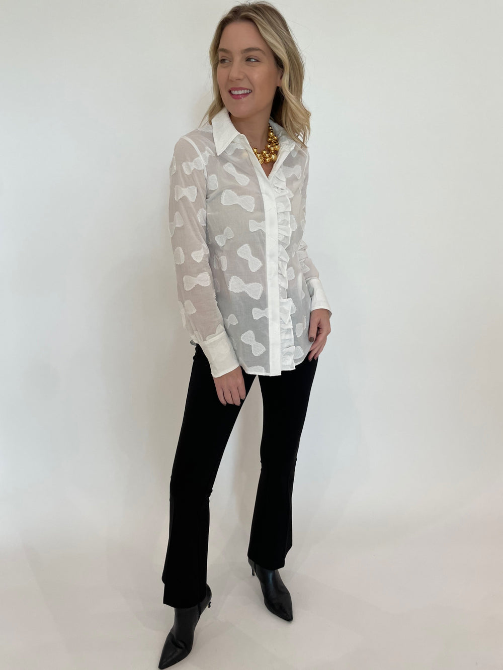 Hope For Flowers Frilled Button Down Shirt in White paired with Peace of Cloth Ella Paramount Knit Pants in Black, Vanessa Baroni Multi Beads Collar Necklace in Gold available at Barbara Katz