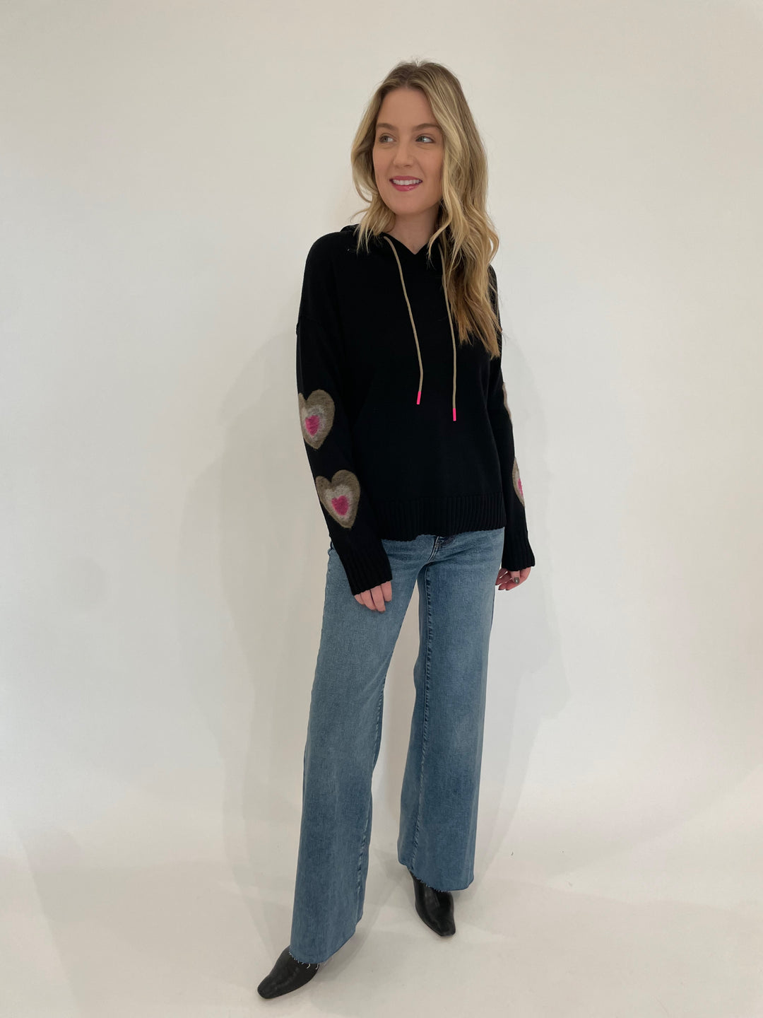 Lisa Todd Catch Me Hoodie in Black paired with Frame Le Slim Palazzo Jeans in Rowley Raw After available at Barbara Katz