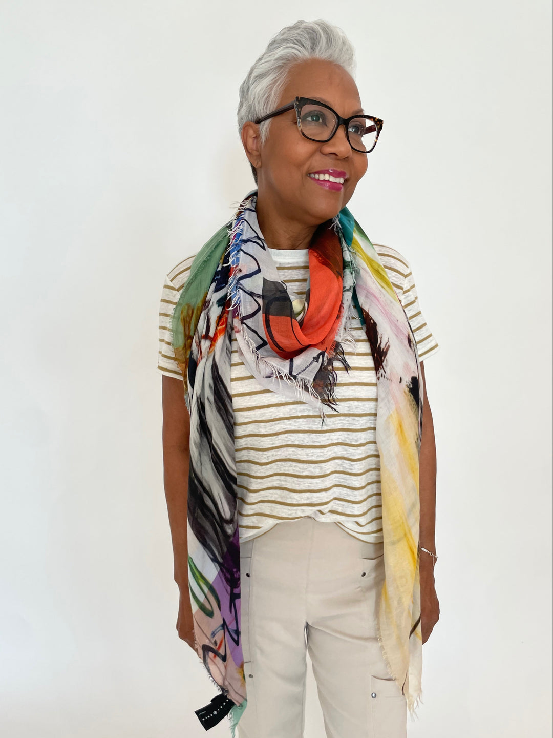 Frame Linen Baby Tee in Dark Khaki with Suzi Roher Cristina Scarf Resort 2024 in Creativity Takes Courage print paired with Elliott Lauren Crop Cargo Pants in Chino available at Barbara Katz