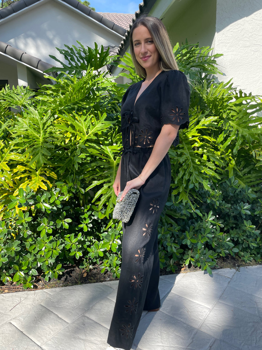 Rails Pari Blouse in Black Eyelet paired with matching Rails Black Emmie Pants, Lorenza Gandaglia Bagatelle Lurex Bag in Camouflage Combo available at Barbara Katz