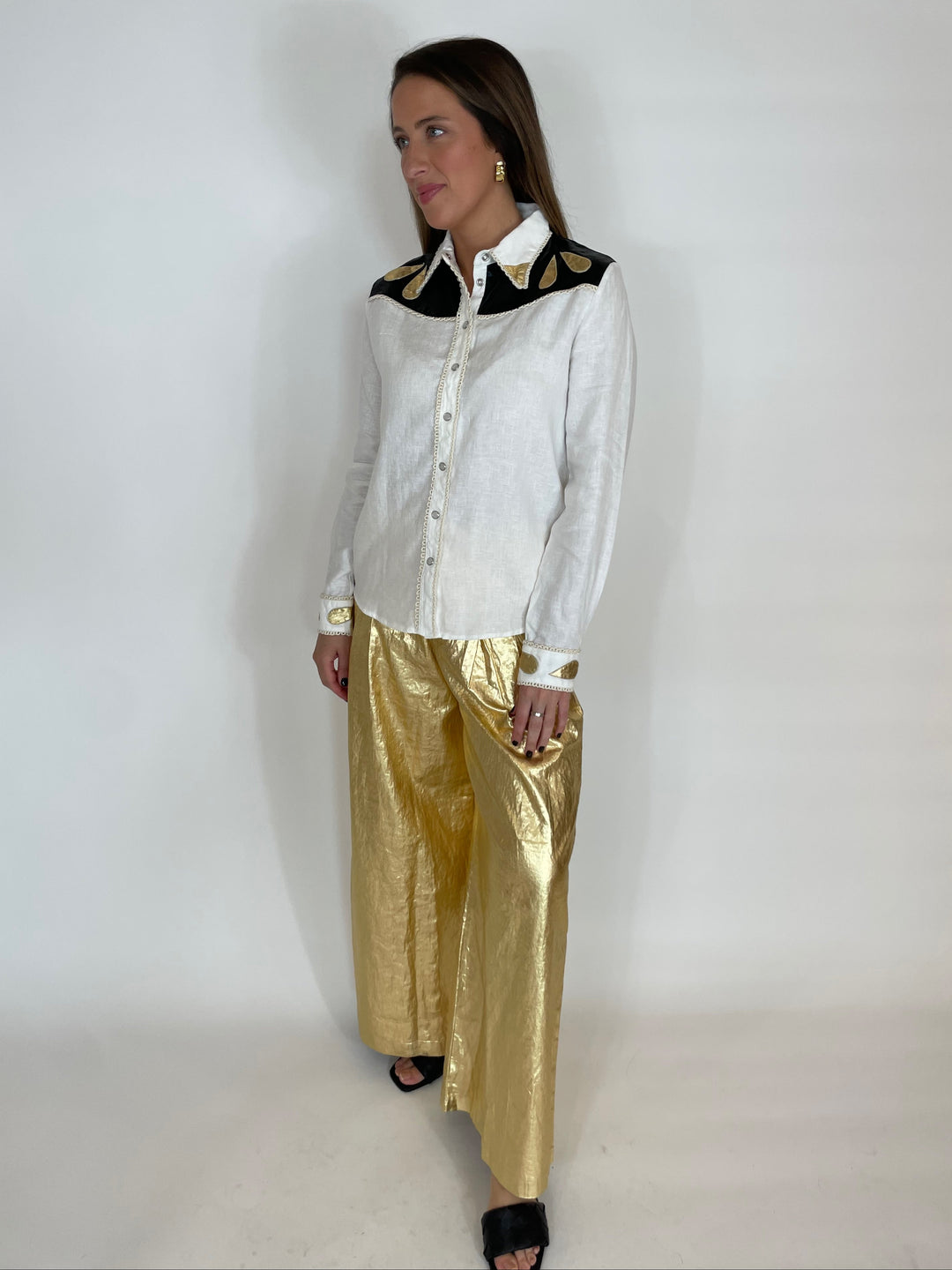 Lanhtropy Far West Linen Shirt in Off White with Metallic Black and Gold paired with Lanhtropy Foiled Linen Culotte Pants in Gold available at Barbara Katz