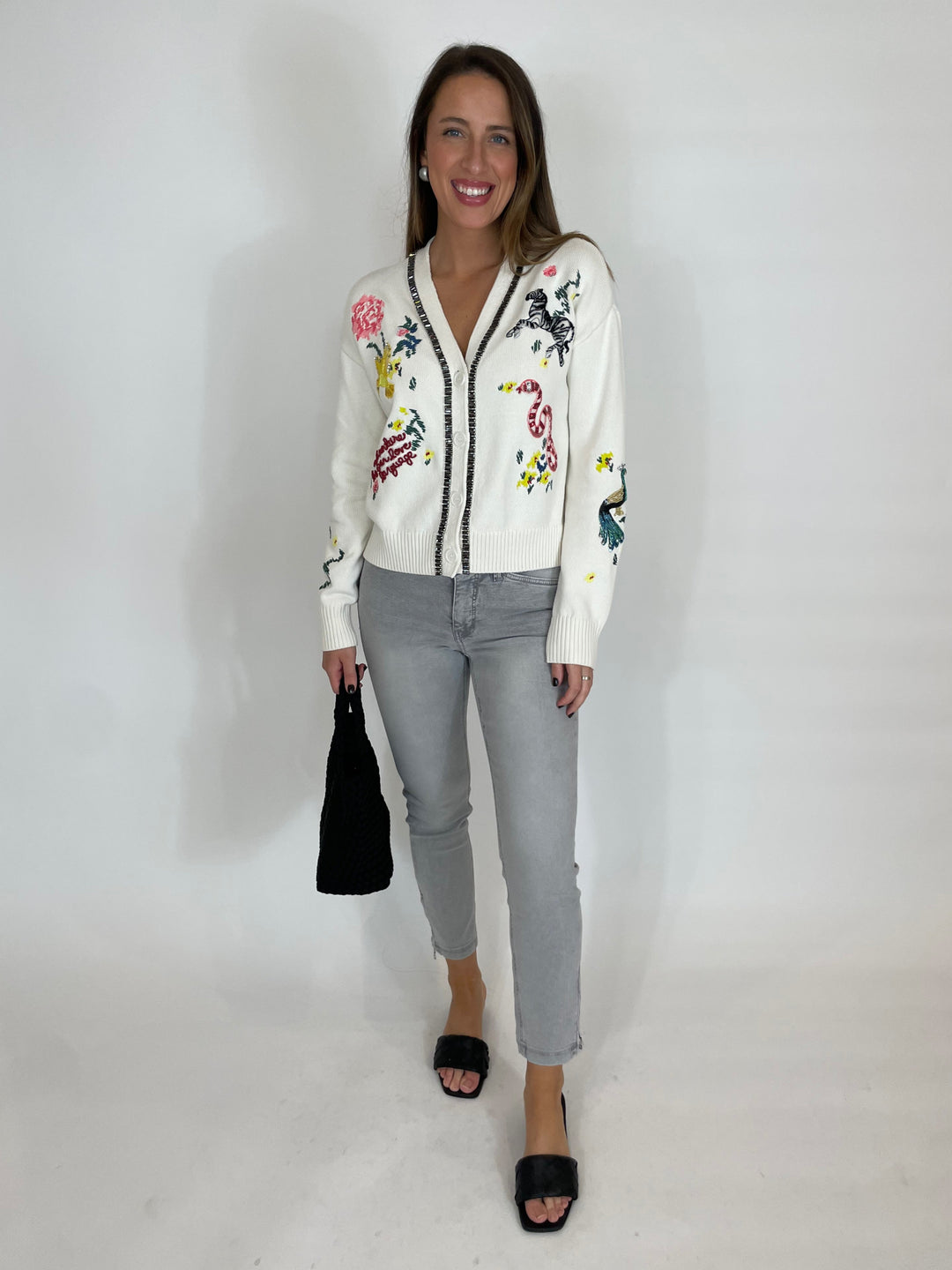 Cinq a Sept Patch Animal Nyla Cardigan in Ivory paired with MAC Denim Dream Chic Crop Jeans in Grey, Sol and Selene Sky's The Limit Small Crossbody Bag in Black available at Barbara Katz