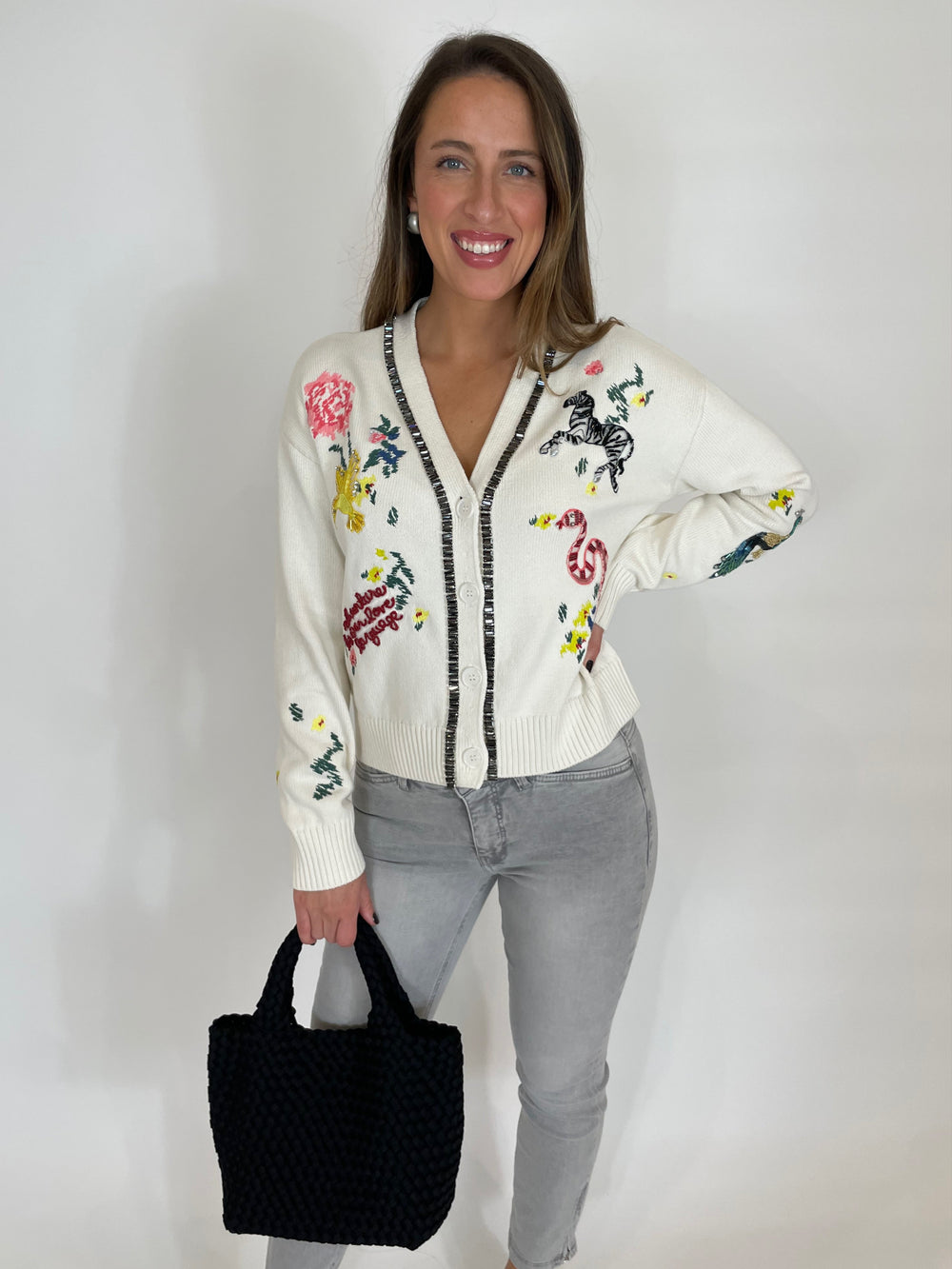 Cinq a Sept Patch Animal Nyla Cardigan in Ivory paired with MAC Denim Dream Chic Crop Jeans in Grey, Sol and Selene Sky's The Limit Small Crossbody Bag in Black available at Barbara Katz