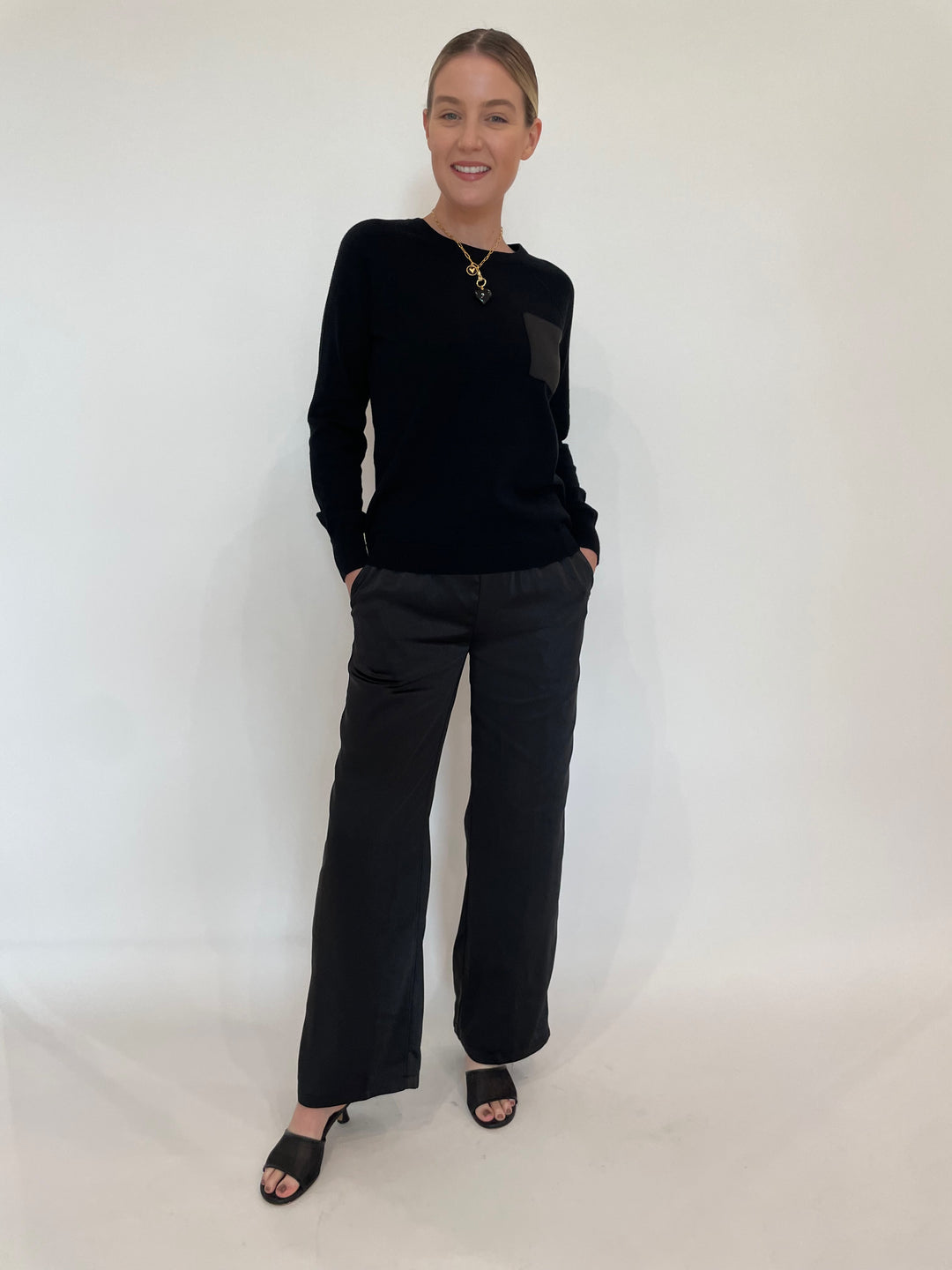 J Society Jette Satin Pocket Sweatshirt in Black paired with matching J Society Jesse Satin Pants in Black, Elizabeth Cole Jewelry Morrigan Necklace in Black available at Barbara Katz