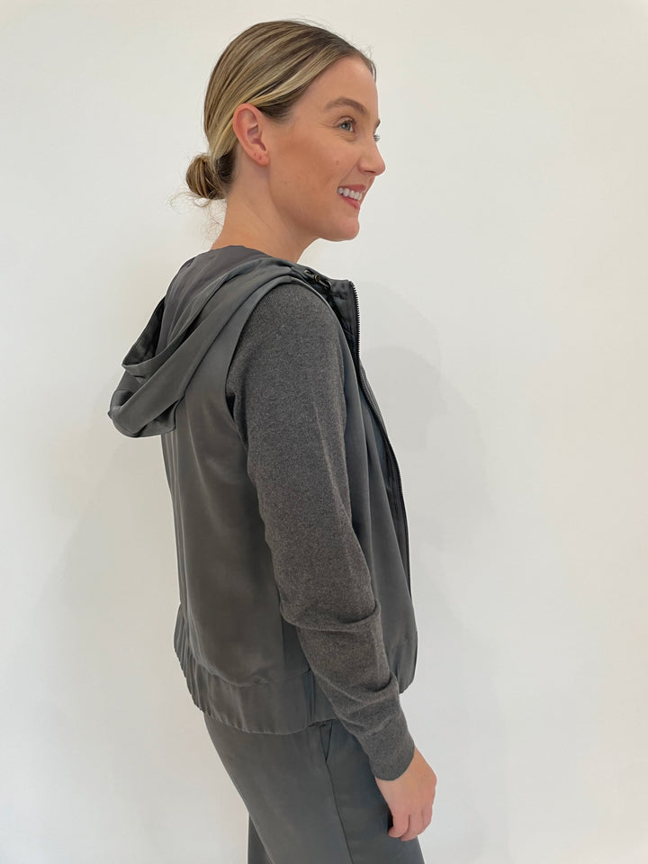 J Society Celeste Satin Hoodie Vest in Gunmetal with Jette Satin Pocket Sweatshirt underneath, paired with matching J Society Jesse Satin Pants in Gunmetal available at Barbara Katz