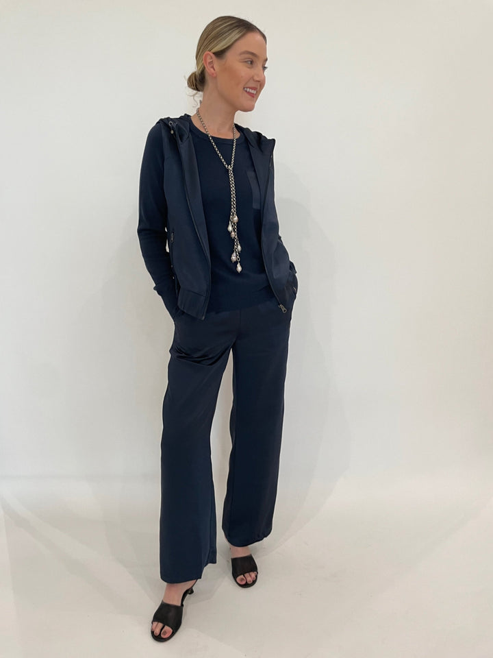 J Society Jesse Satin Pants in Navy paired with matching J Society Jette Satin Pocket Sweatshirt and Celeste Satin Hoodie Vest in Navy, Suzy T Pearl Lariat Necklace in Antique Silver available at Barbara Katz