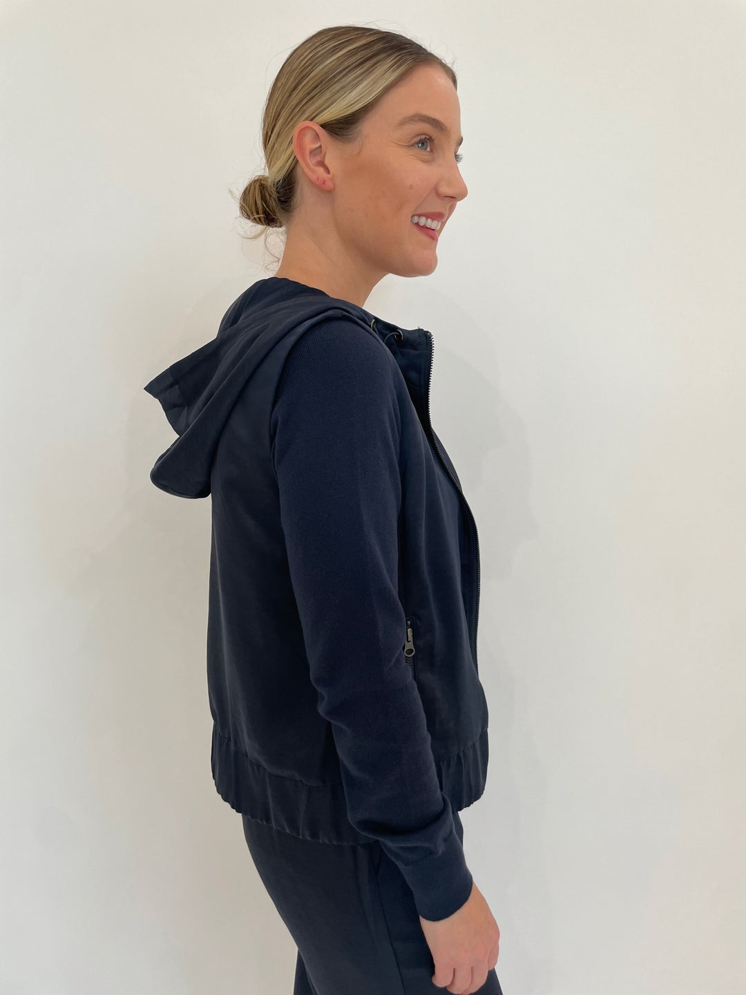 J Society Celeste Satin Hoodie Vest in Navy with Jette Satin Pocket Sweatshirt underneath available at Barbara Katz