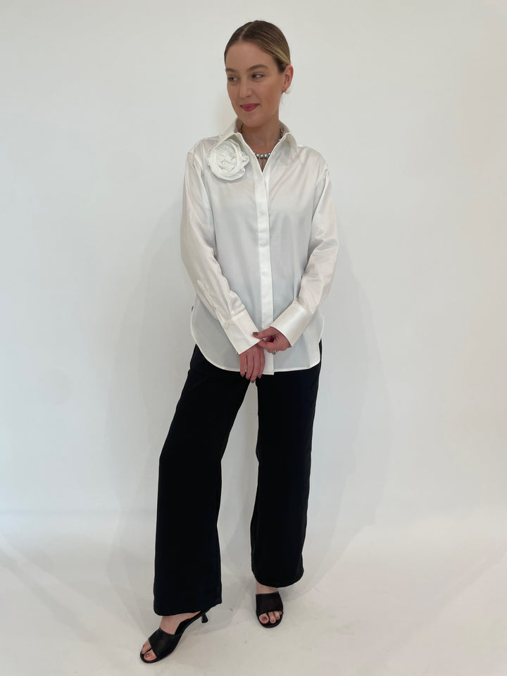 Hinson Wu Halsey Long Sleeve Shirt With Rosette in Cloud paired with Peace of Cloth Jules Paramount Knit Pants in Black, Suzi T French Necklace in Silver With Grey Pearls available at Barbara Katz