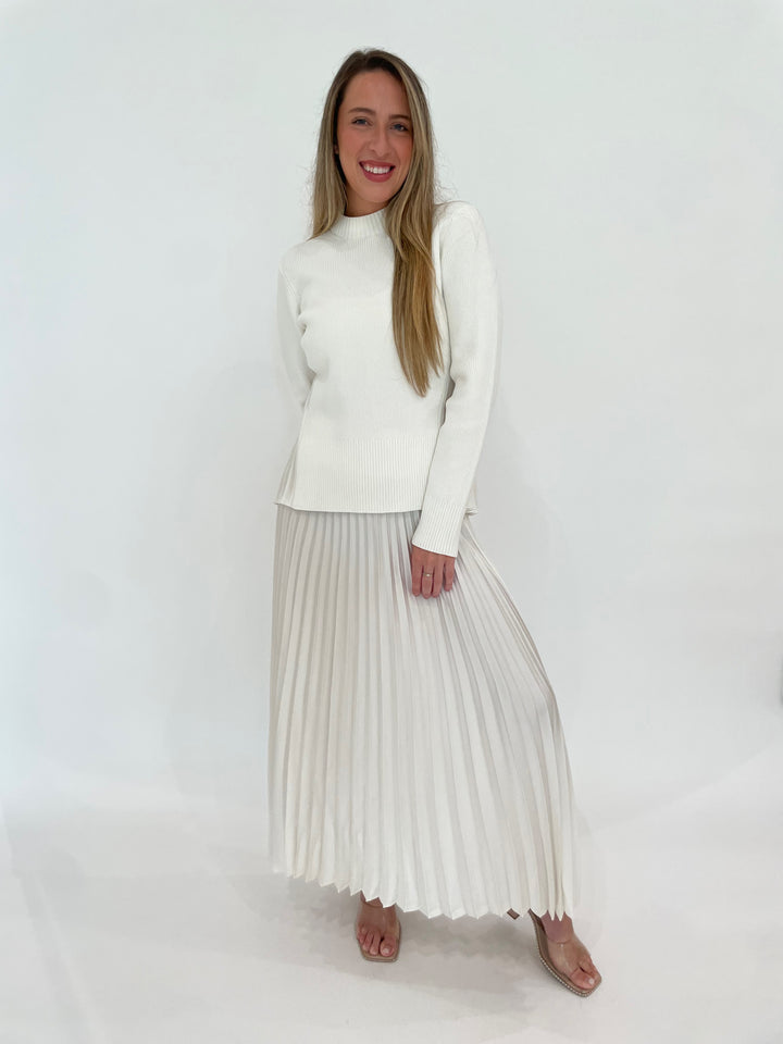 Simkhai Maeve Pullover Top in Ivory paired with Simkhai Valor Pleated Midi Skirt available at Barbara Katz