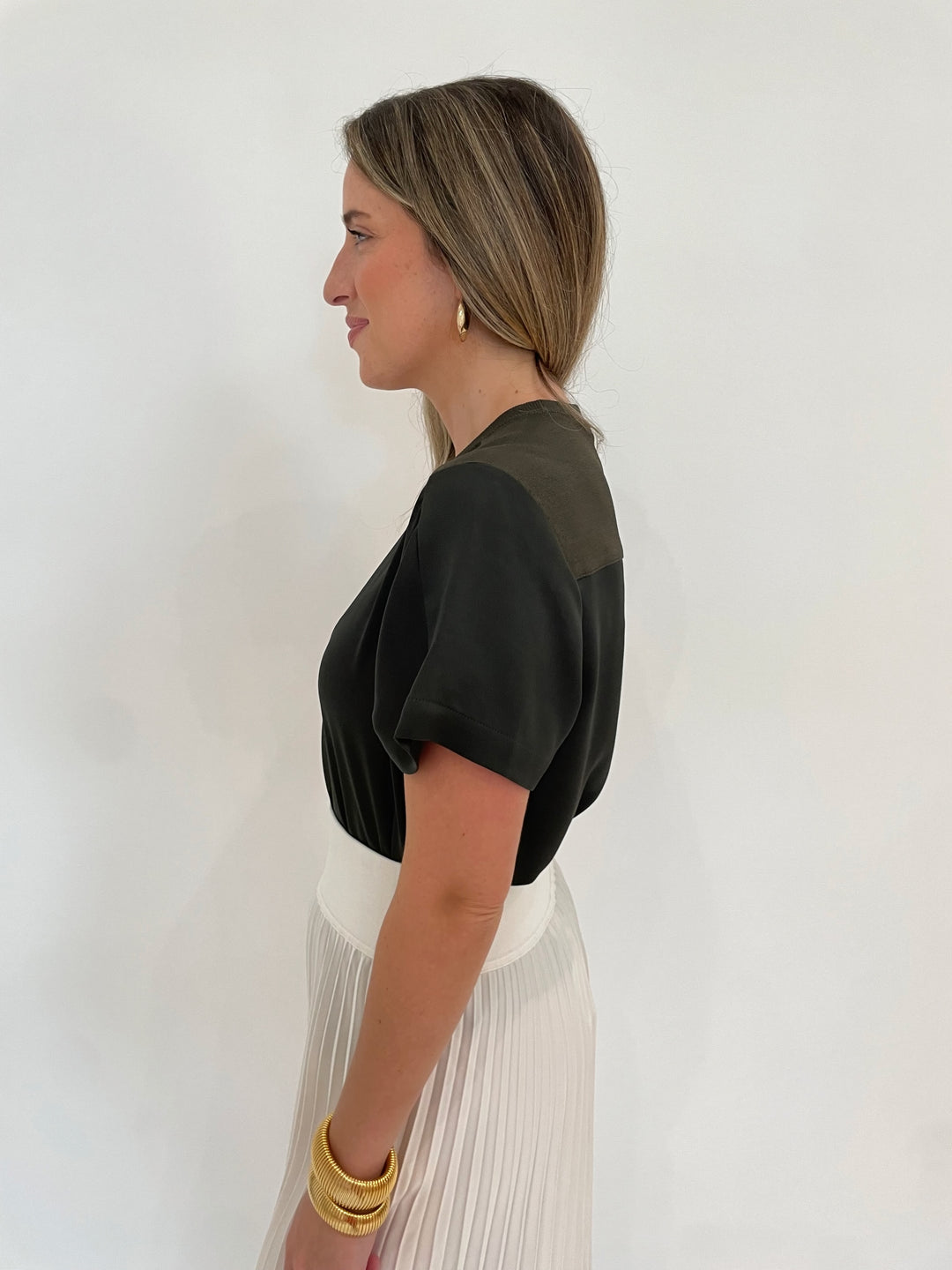 Simkhai Addy Short Sleeve Knit Back T- Shirt in Moss paired with Valor Midi Skirt in Ivory, BK Cobra Cuff and Bracelet, BK Bianca Puffy Triangle Open Hoop Earrings - all available at Barbara Katz