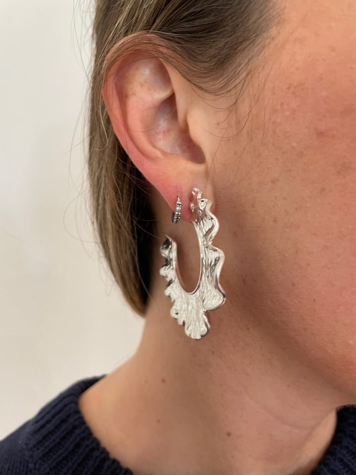 BK Jewelry July Hammered Wavy Metal Hoop Earrings in Worn Silver available at Barbara Katz