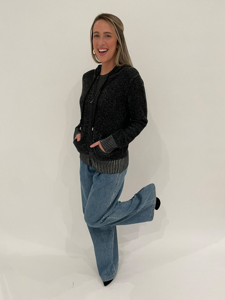 Pure Amici Folklore Cashmere Full Zip Hoodie in Black paired with Agolde Ellis Wide Leg Trousers in Baffle, BK Bianca Puffy Triangle Open Hoop Earrings in Silver available at Barbara Katz