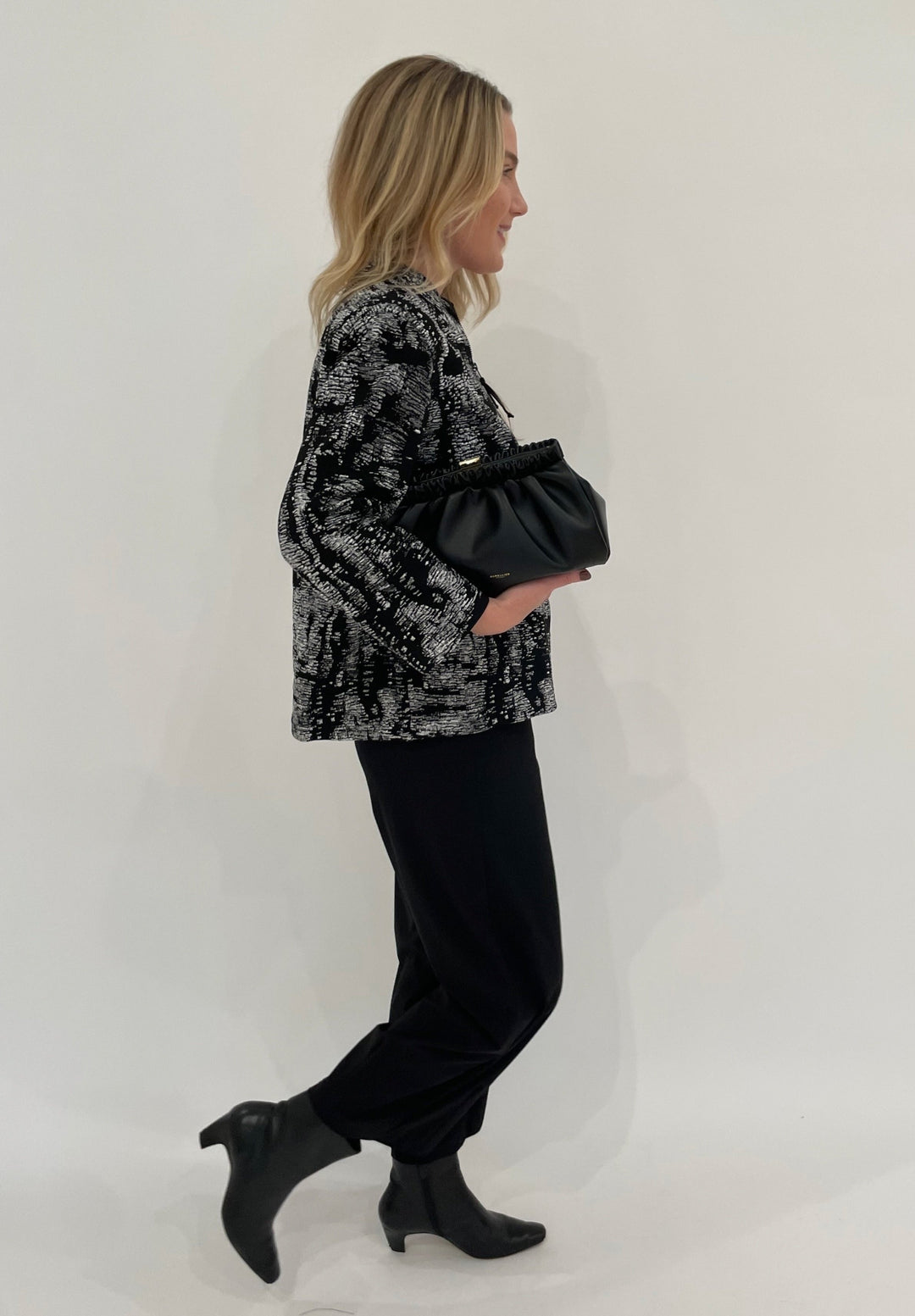 Caroline Rose Melange Knit Zip Jacket in Grey/White/Black paired with Raffaello Rossi Sally 7/8 Pants in Black, DeMellier Miami Clutch in Black - all available at Barbara Katz