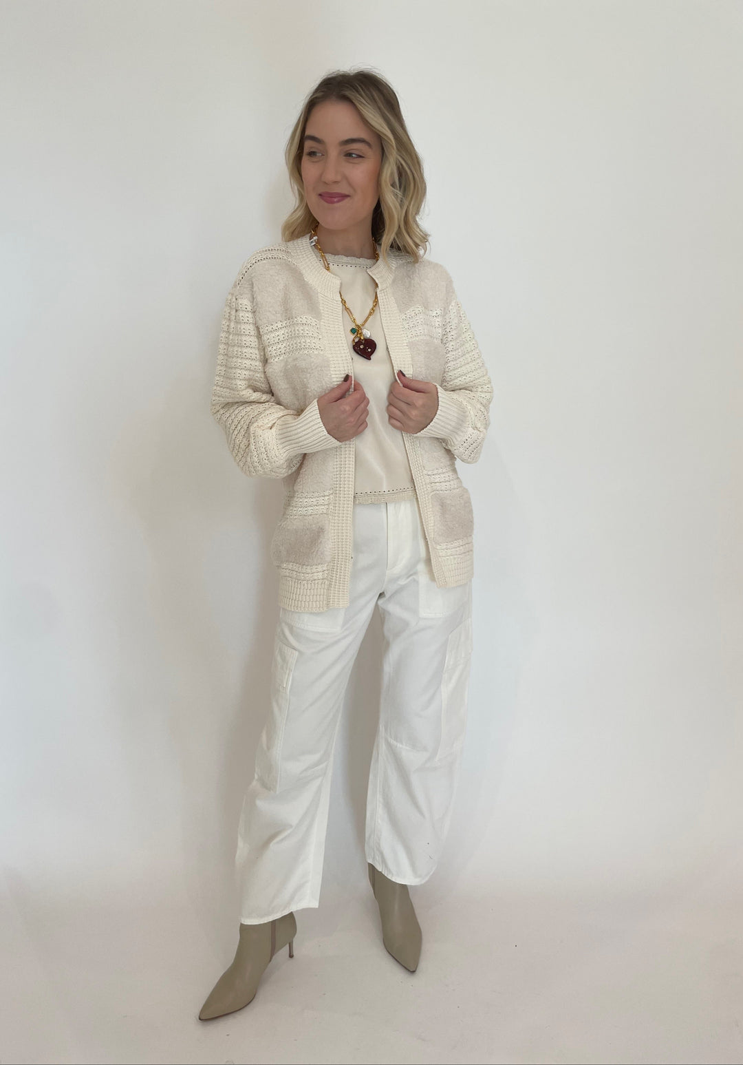 Melissa Nepton Cece Vegan Leather Sleeveless Top in Cream layered with Romeo Fuzzy Crochet Cardigan in Cream, paired with Citizens of Humanity Marcelle Low Slung Easy Cargo Pants in Pashmina, Lizzie Fortunato Murano Heart Necklace available at Barbara Katz