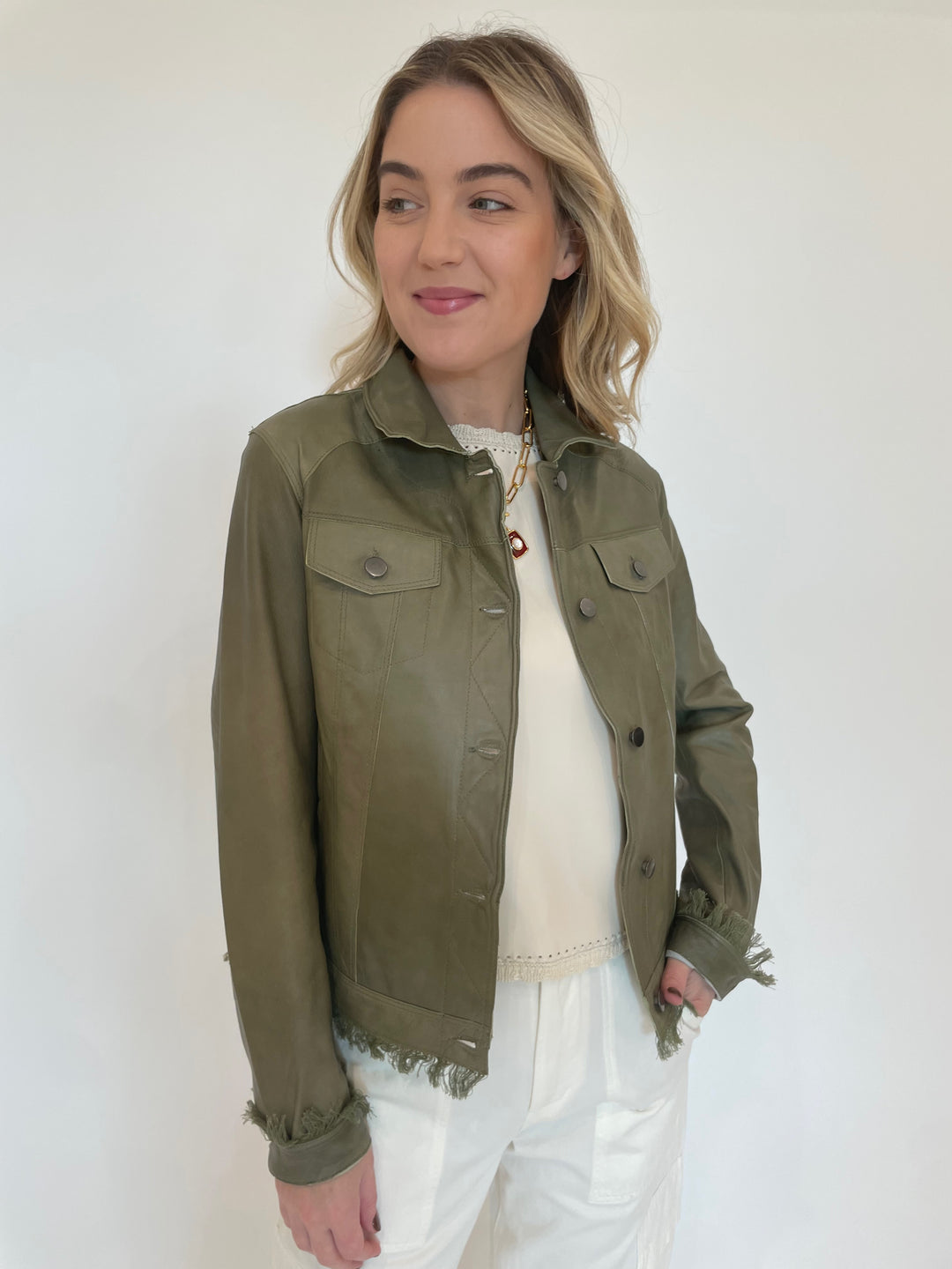 Jakett Alexa Patina Leather Jacket in Army with Melissa Nepton Cream Cece Vegan Leather Sleeveless Top underneath, Lizzie Fortunato Helios Charm Necklace available at Barbara Katz