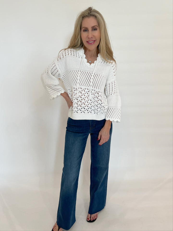 Repeat Ajour Pullover Sweater With Crochet Details in White paired with Frame Denim Le Slim Palazzo Raw After Jeans in Lupine available at Barbara Katz