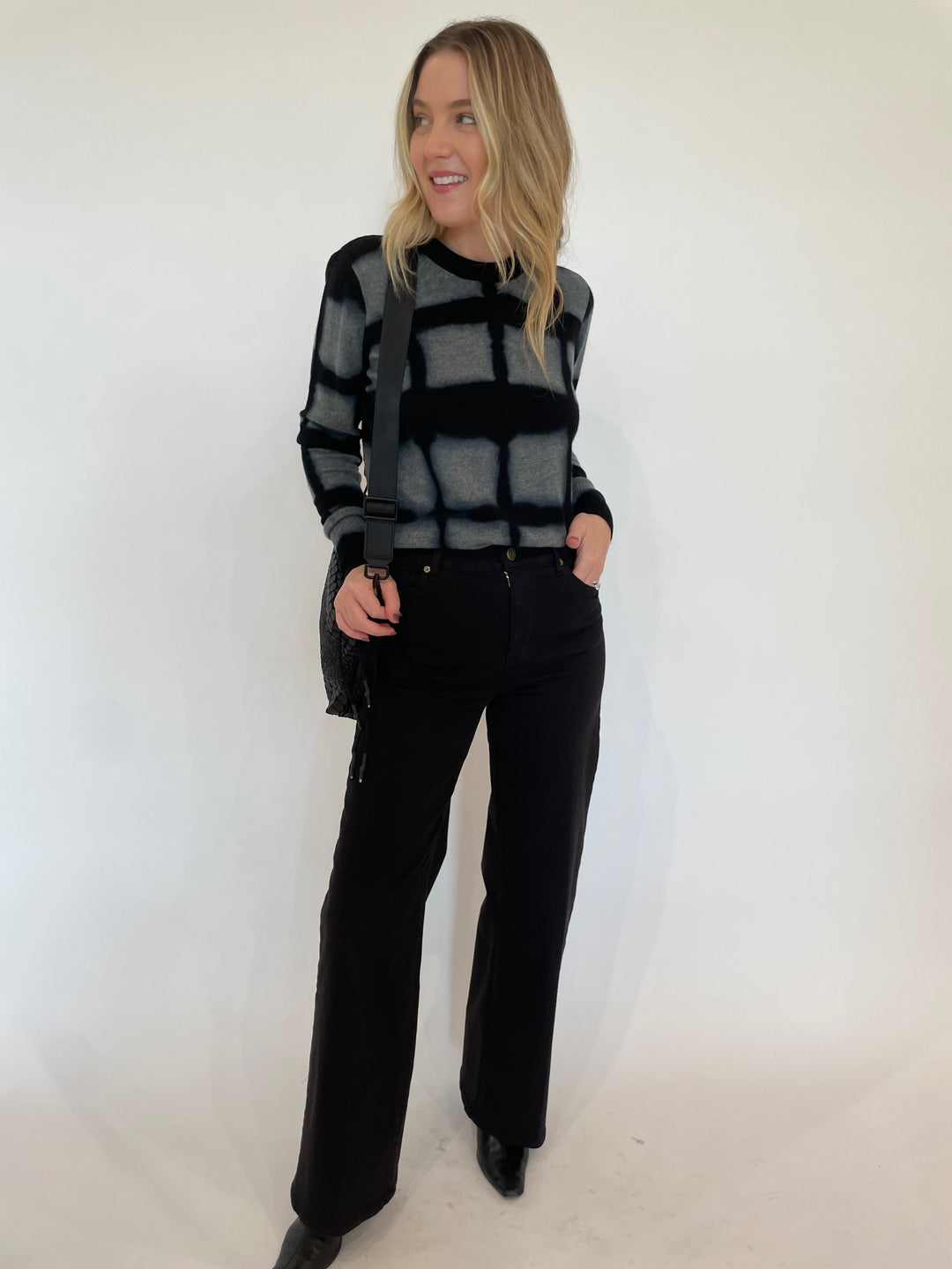 Autumn Cashmere Shibori Plaid Crew Sweater in Cement paired with Frame Le Slim Palazzo Wide Leg Jeans in Black, Daniella Lehavi Tokyo Crossbody Bag in Black available at Barbara Katz