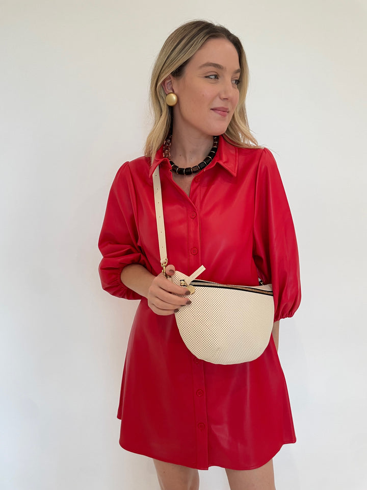 BK Anya Vegan Leather Shirt Dress in Red with Pono Mollie Barile Clip Earrings in Gold, Pono Helaine Necklace in Tortuga, Clare V Grande Fanny Bag in Cream Perf available at Barbara Katz