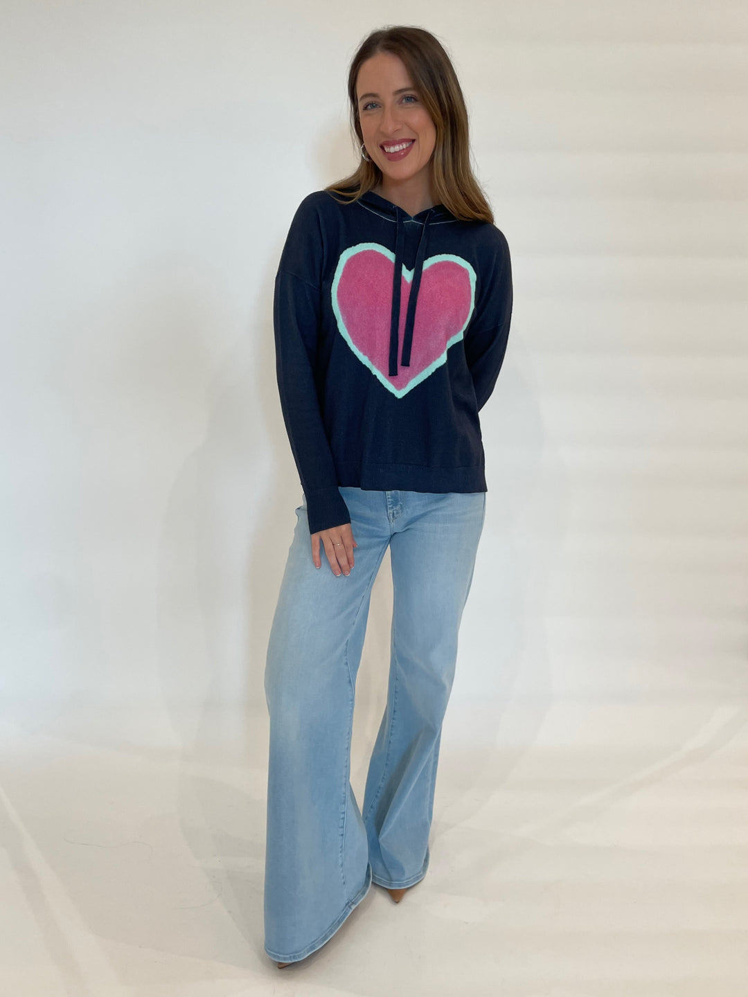 J Society Elisa Heart Hoodie in Navy paired with Mother Denim The Roller Sneak Jeans in Ball's In Your Court available at Barbara Katz