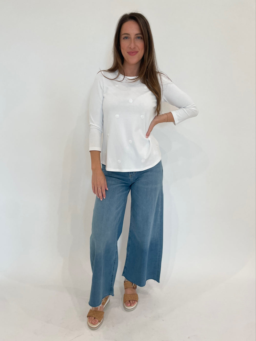 E.L.I Ruth 3/4 Sleeve Top With Sequin Dots in White paired with Citizens of Humanity Lyra Crop Wide Leg Jeans in Bhodi available at Barbara Katz