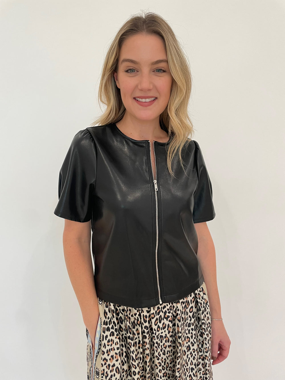 Melissa Nepton Houston Zip-Up Faux Leather Top in Black paired with ME369 Hailey Sand Printed Skirt available at Barbara Katz