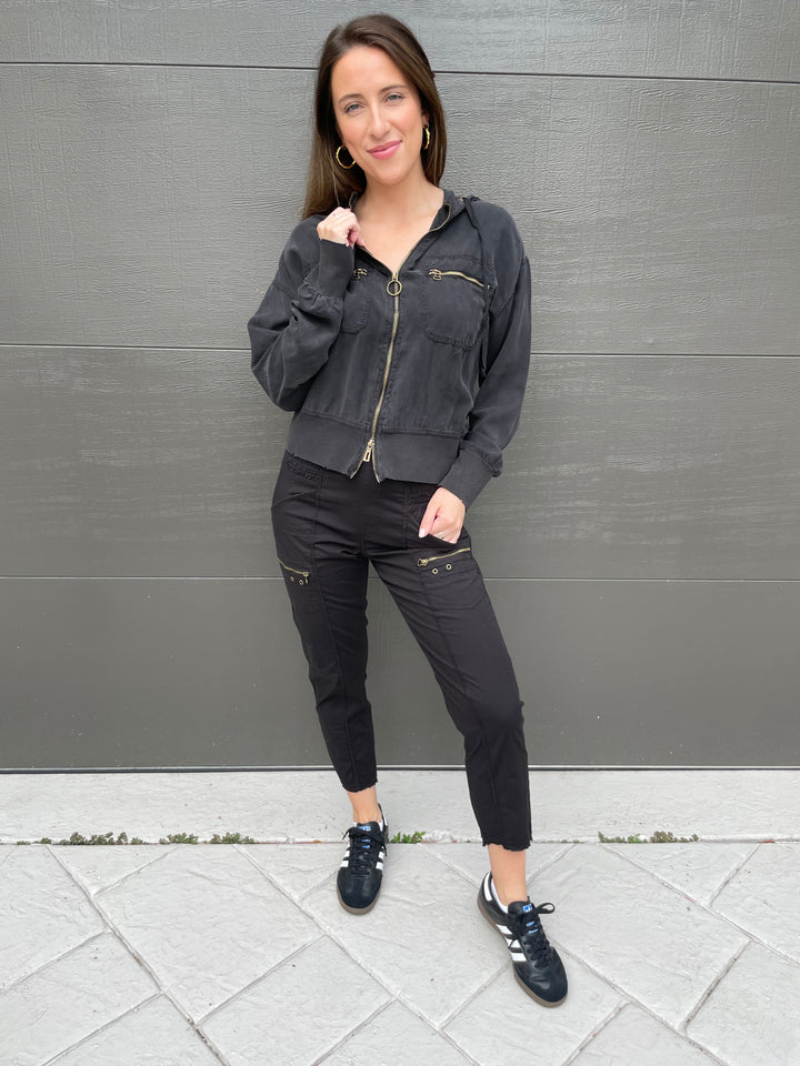 XCVI Darcy Distressed Bomber Jacket in Black paired with XCVI Sunny Cargo Pants in Black, Dean Davidson Nomad Midi Hoops in Gold available at Barbara Katz