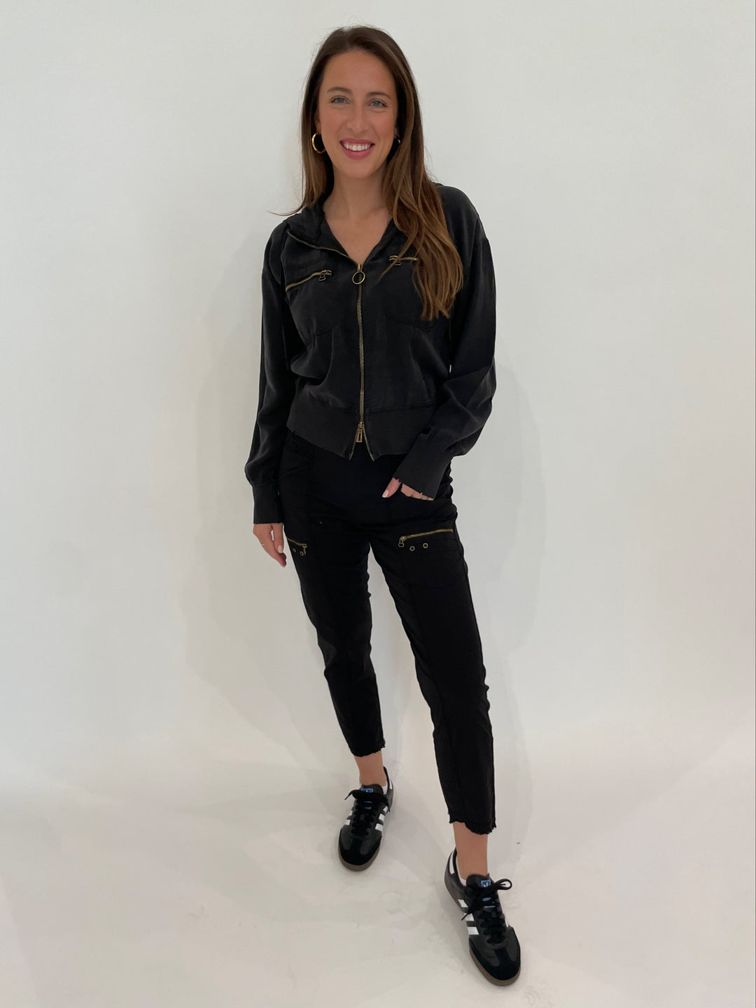 XCVI Darcy Distressed Bomber Jacket in Black paired with Wearables Acker Slim Pants in Black, Dean Davidson Nomad Midi Hoops in Gold available at Barbara Katz