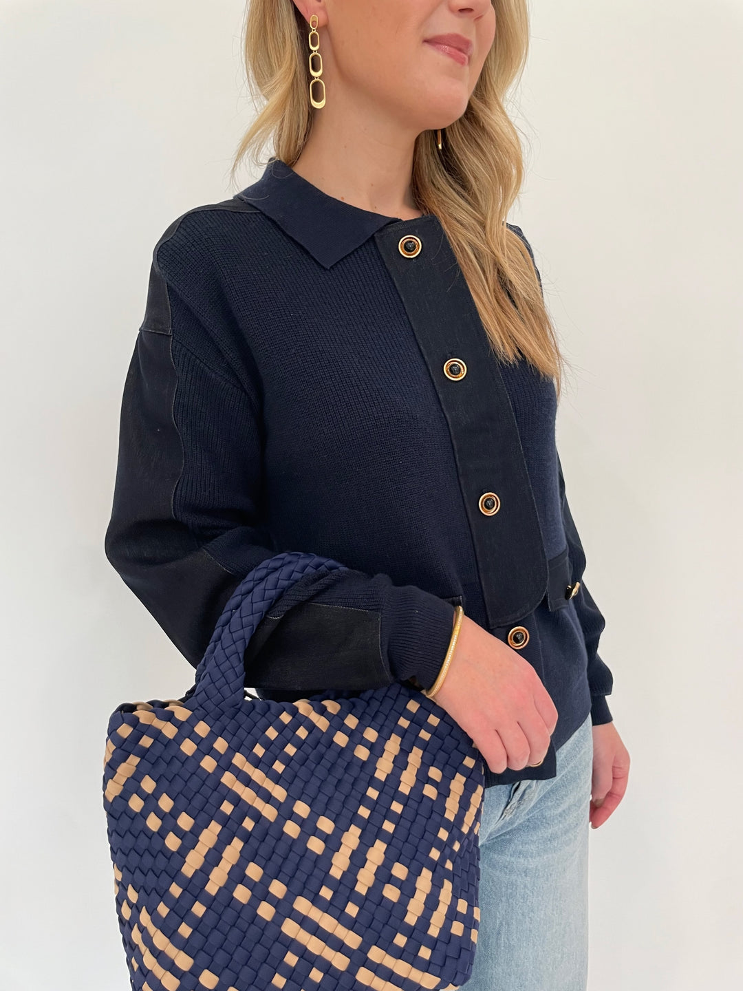 Leo & Ugo Denim Knit Jacket in Navy paired with Pistola Ryder High Rise Cuffed Jeans, Dean Davidson Gold Bleecker Statement Drop Earrings, Sol and Selene Sky's The Limit Small Crossbody Bag in Navy/Nude - all available at Barbara Katz