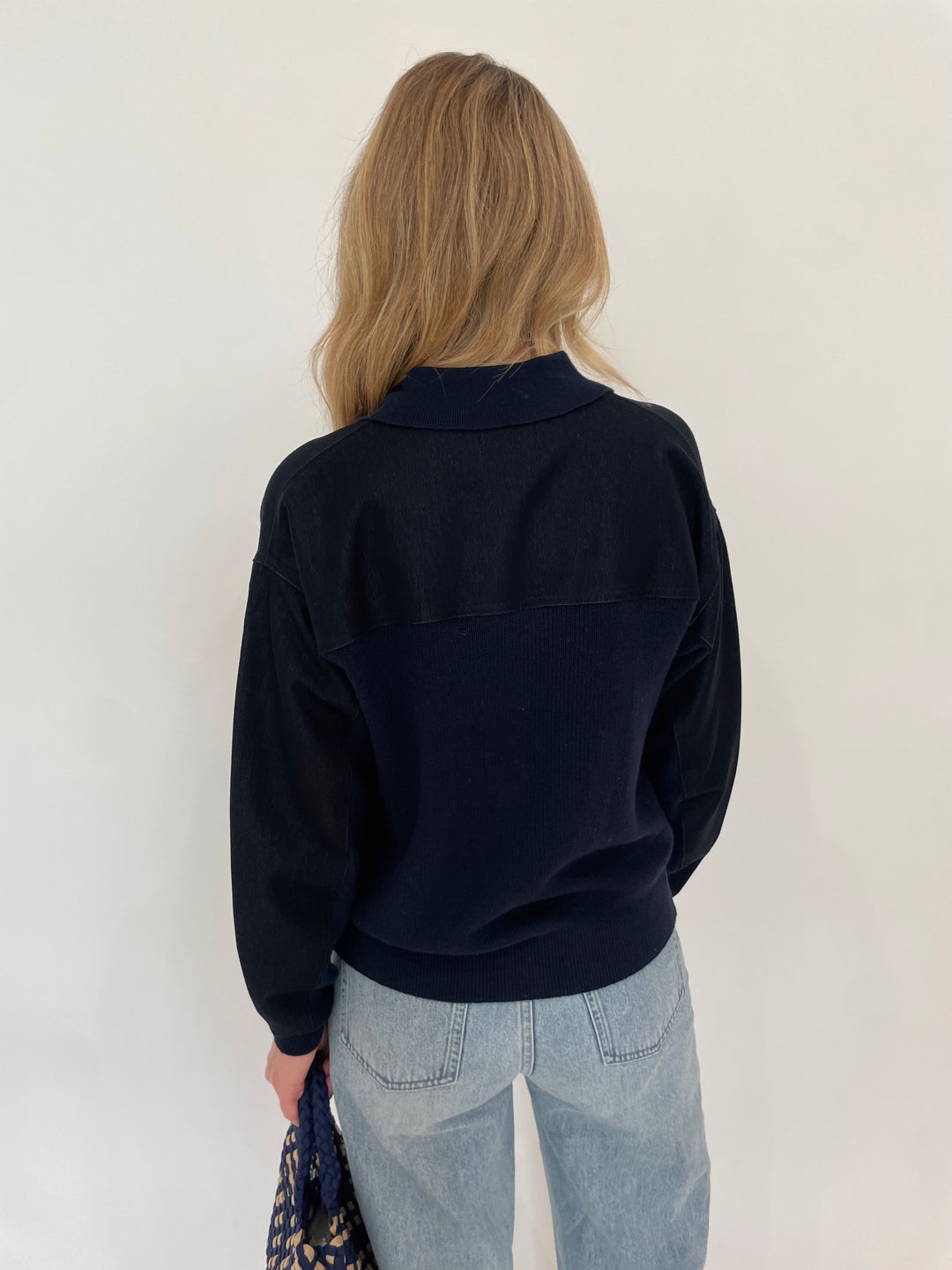 Leo & Ugo Denim Knit Jacket in Navy paired with Pistola Ryder High Rise Cuffed Jeans, Sol and Selene Sky's The Limit Small Crossbody Bag in Navy/Nude - all available at Barbara Katz