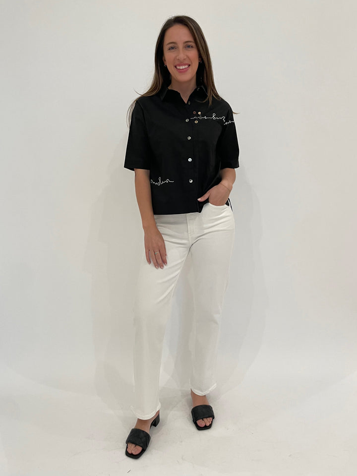 Terra Angela Short Sleeve Boxy Button Shirt in Black paired with Citizens of Humanity Palma Straight Jeans in Soft White available at Barbara Katz