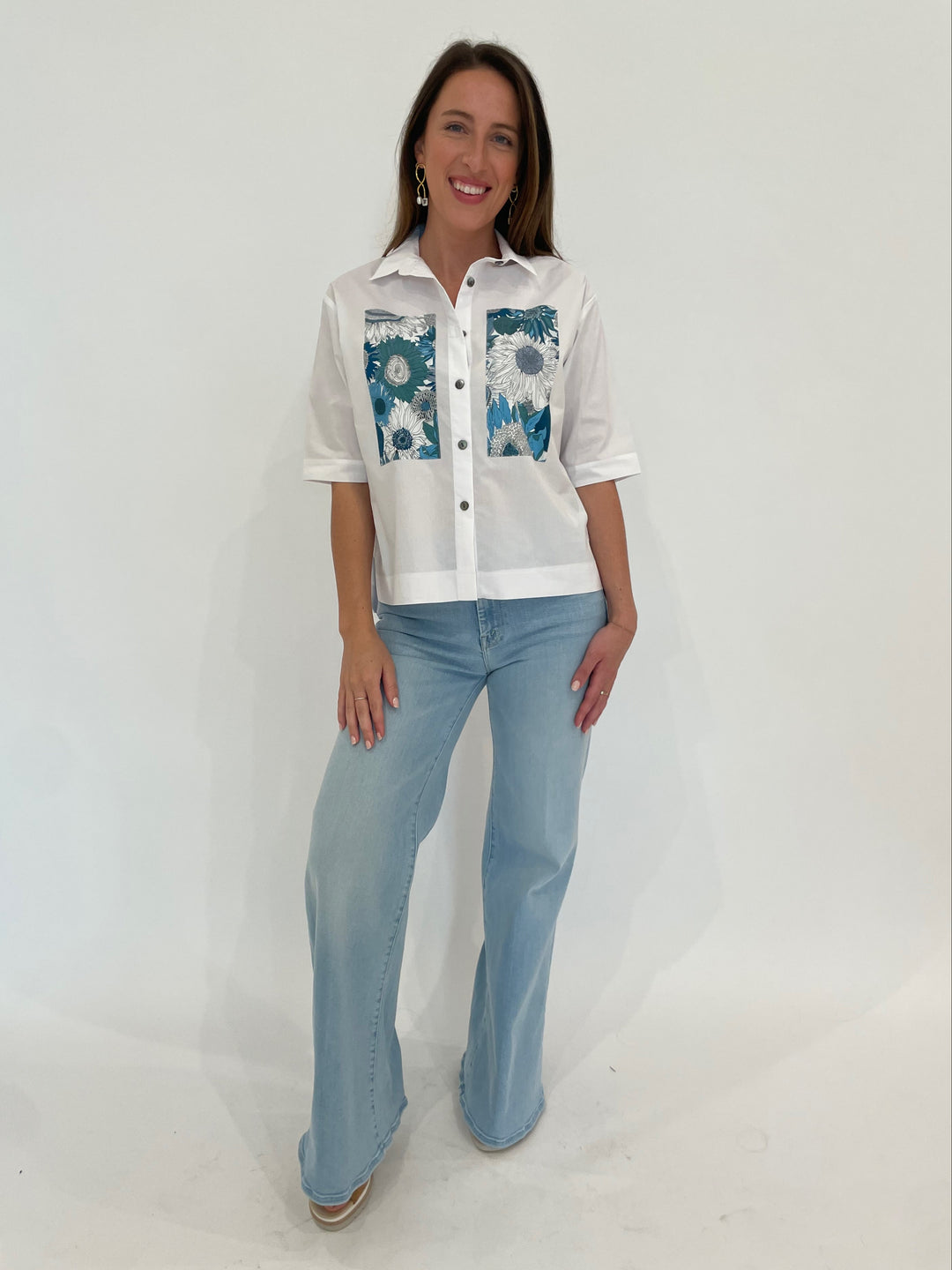 Terra Carmen Flower Shirt in White/Blue paired with Mother Denim The Roller Sneak Jeans in Ball's In Your Court, Lizzie Fortunato Etienne Earrings in Gold available at Barbara Katz