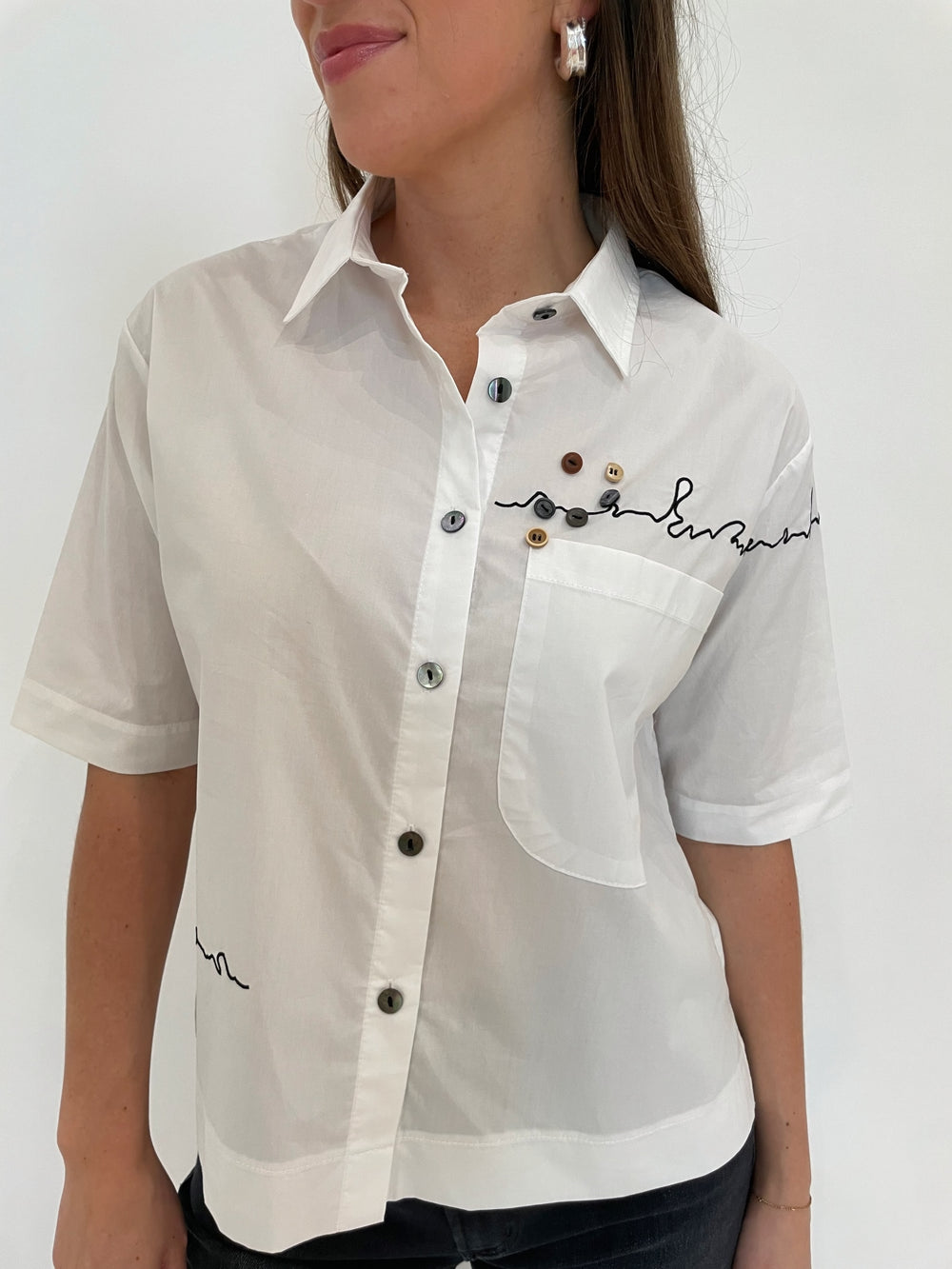 Terra Angela Short Sleeve Boxy Button Shirt in White with Lizzie Fortunato Onda Hoop Earrings in Silver available at Barbara Katz