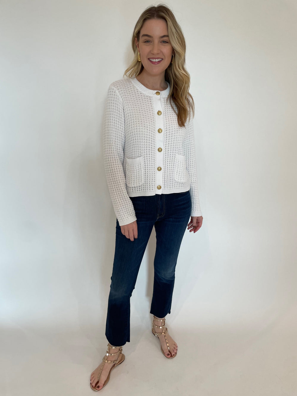 Kinross Textured Button Cardigan in White paired with Mother The Insider Crop Step Fray Jeans in Off Limits, BK Drop Long Post Earrings in Gold available at Barbara Katz