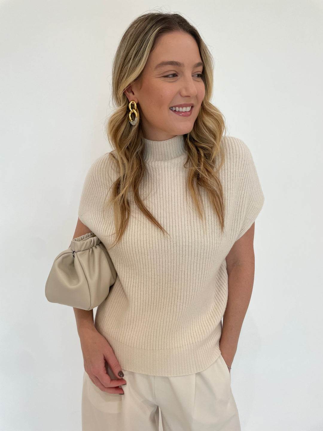 Lilla P. Ribbed Funnel Neck Sweater in Ivory with Alexis BIttar Solanales Crystal Large Link Earrings in Gold,  DeMellier Miami Clutch in Off White available at Barbara Katz